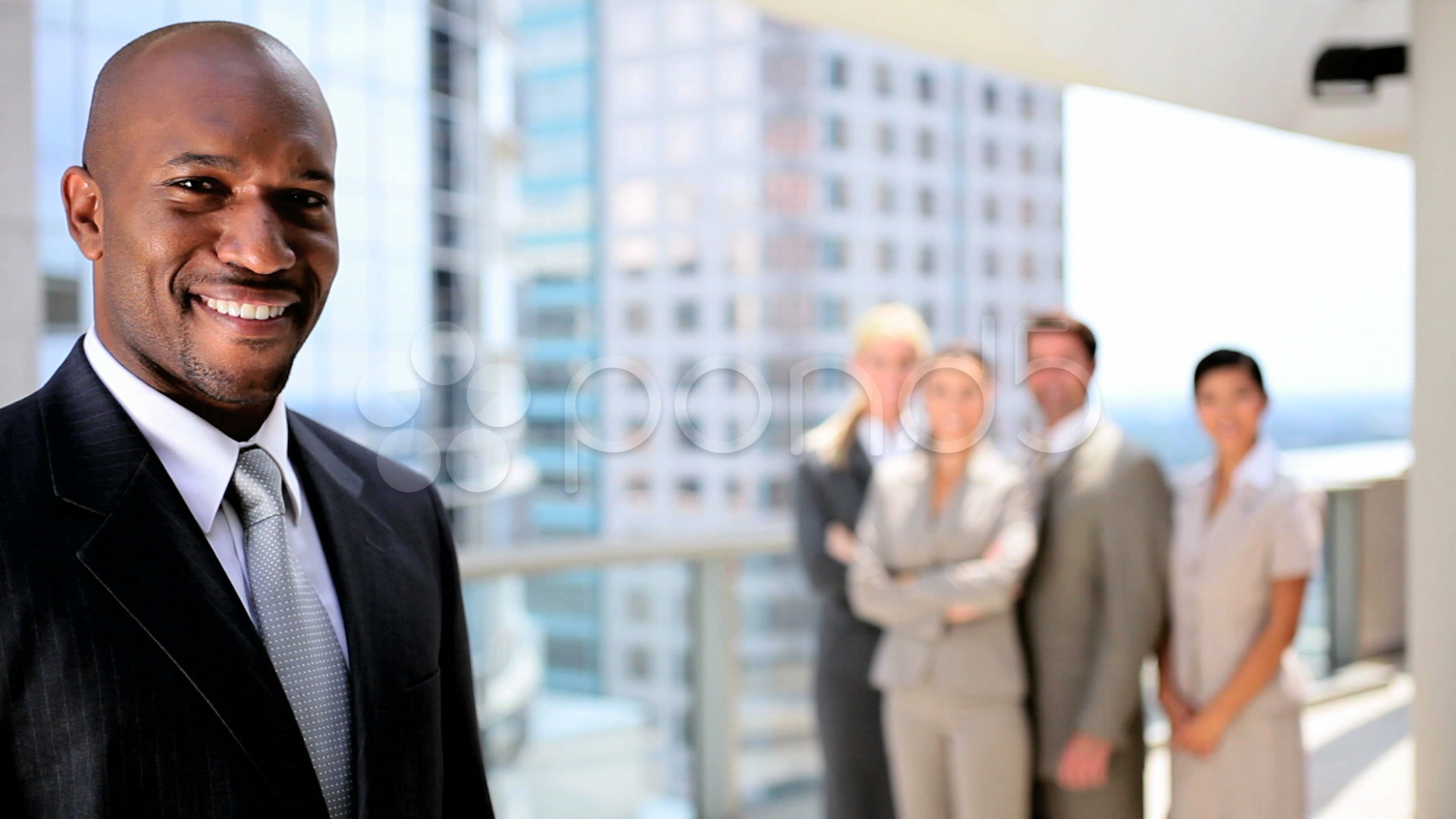 Video: Portrait of African American Businessman with Colleagues ...