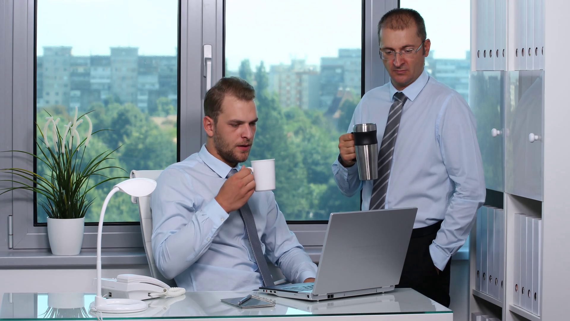 Businessman drinking tea photo