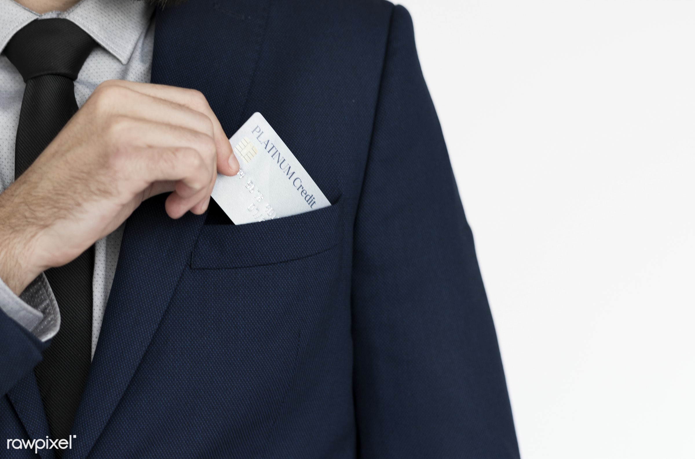 Businessman putting a business card into his pocket