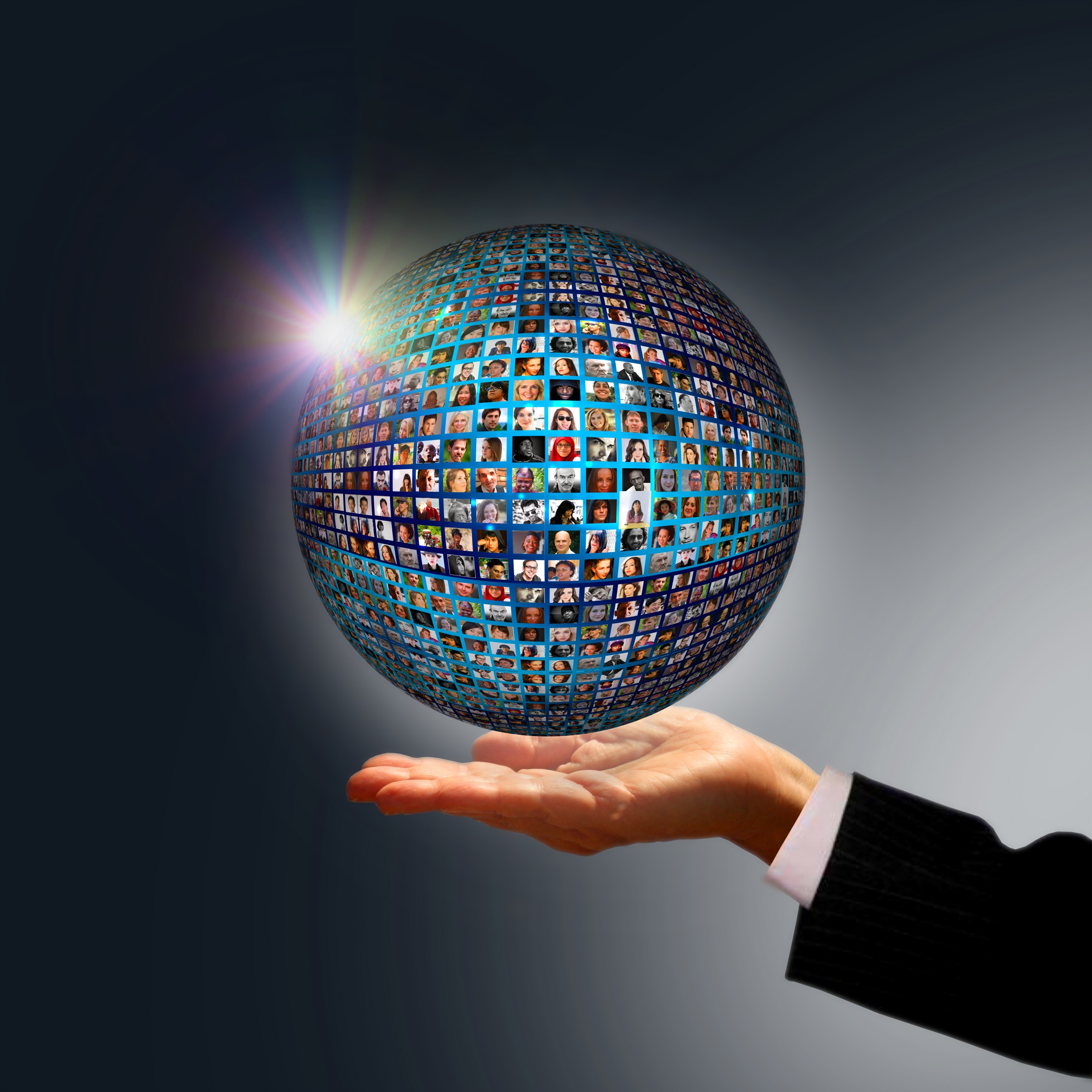 Businessman holding a globe made of people photo