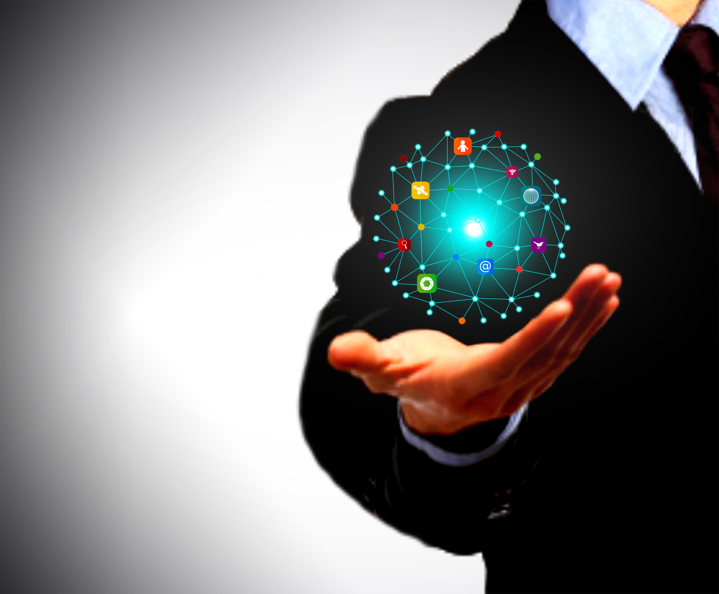 Businessman holding a globe with information technology icons photo