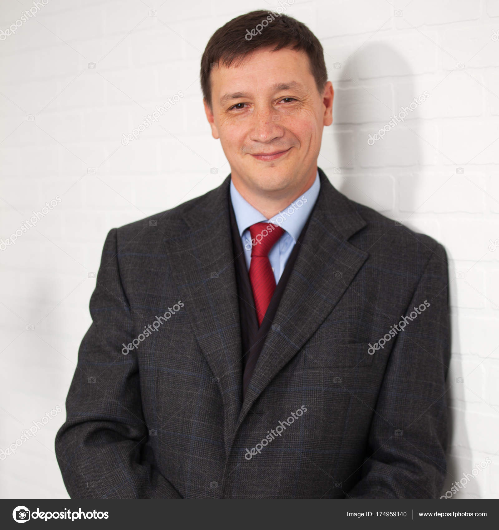 Businessman in coat — Stock Photo © TatyanaGl #174959140