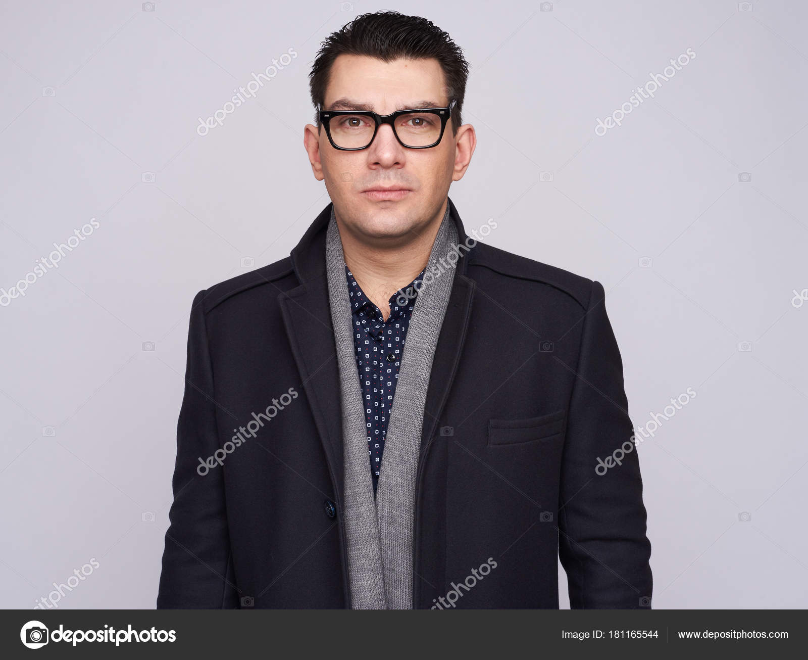 Handsome businessman wearing glasses and coat — Stock Photo ...