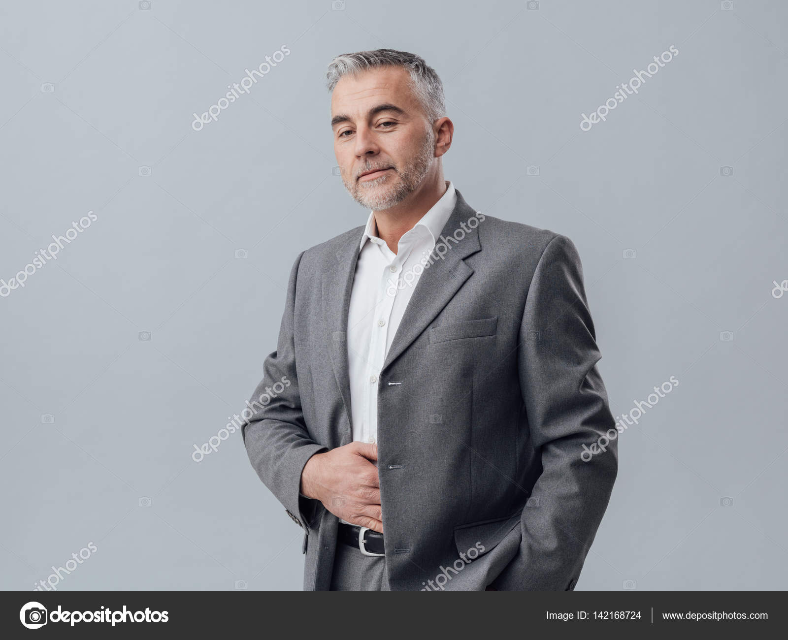 Confident businessman posing — Stock Photo © stokkete #142168724