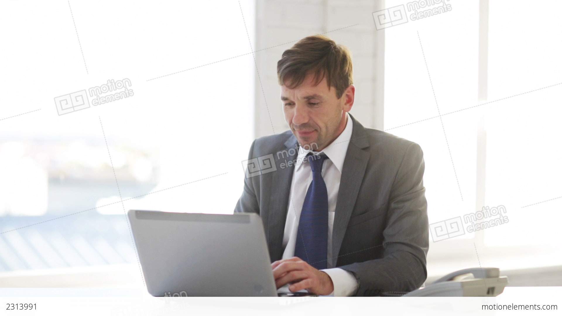 Businessman With Laptop Computer And Phone Stock video footage | 2313991