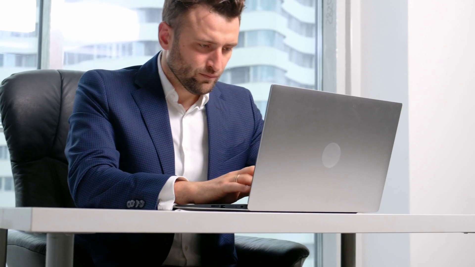 Businessman in formal wear using laptop in office Stock Video ...
