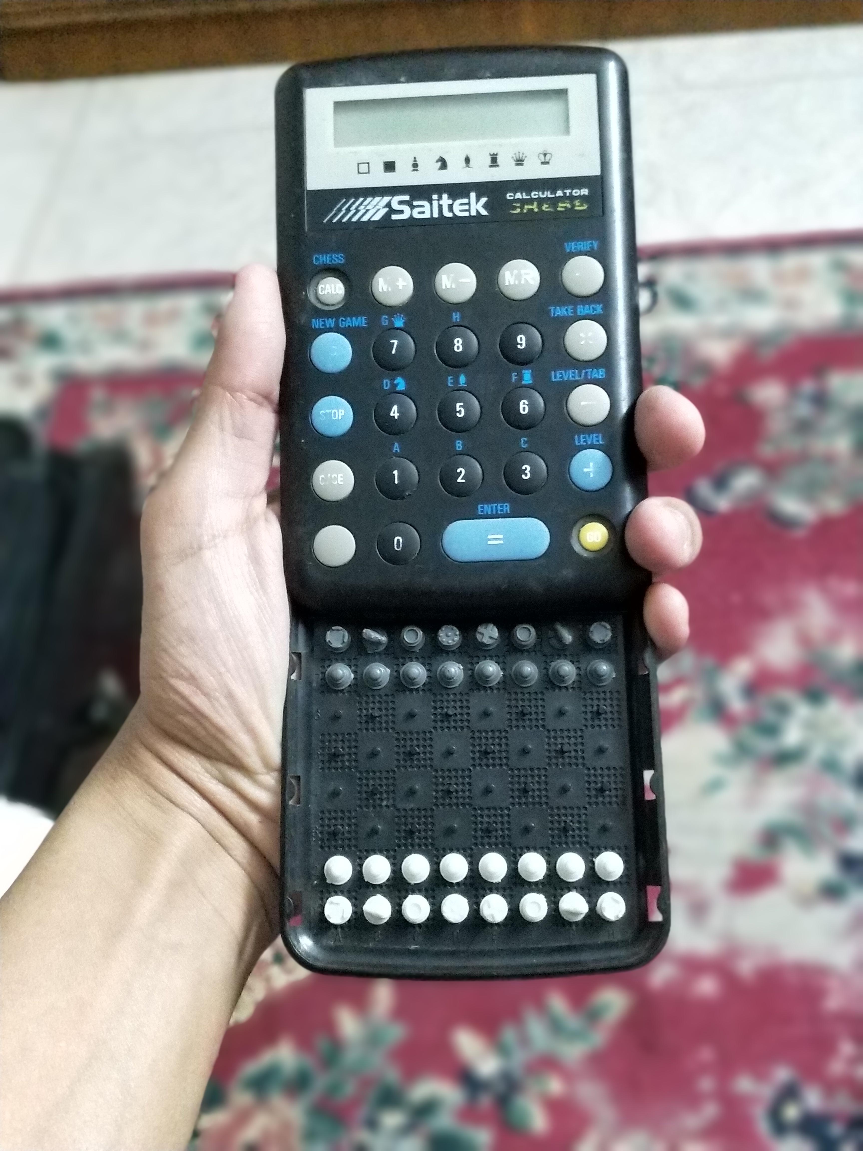 I have a calculator with a built-in chess board. : mildlyinteresting