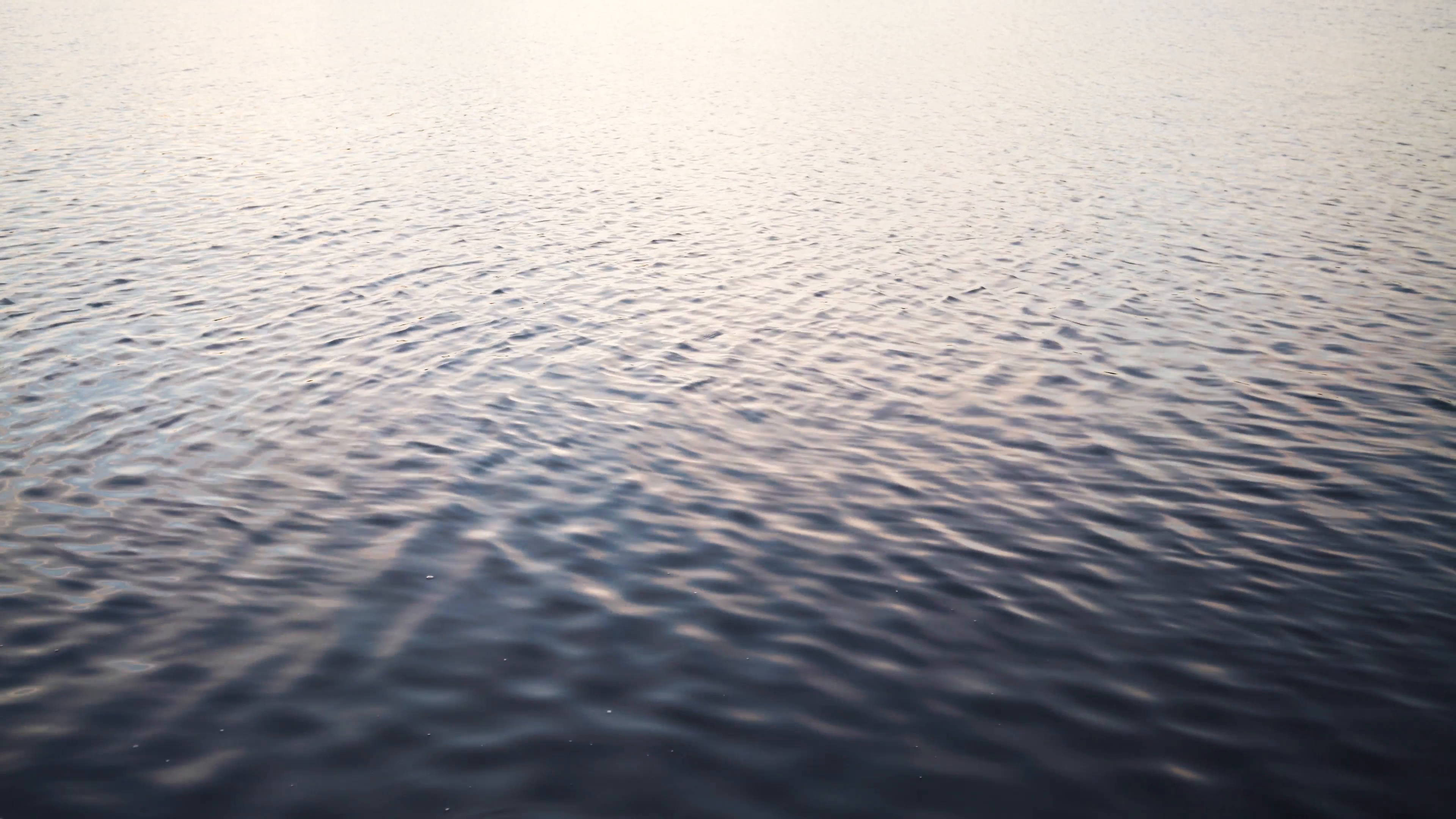 calm water surface background in eveling sunset light Stock Video ...