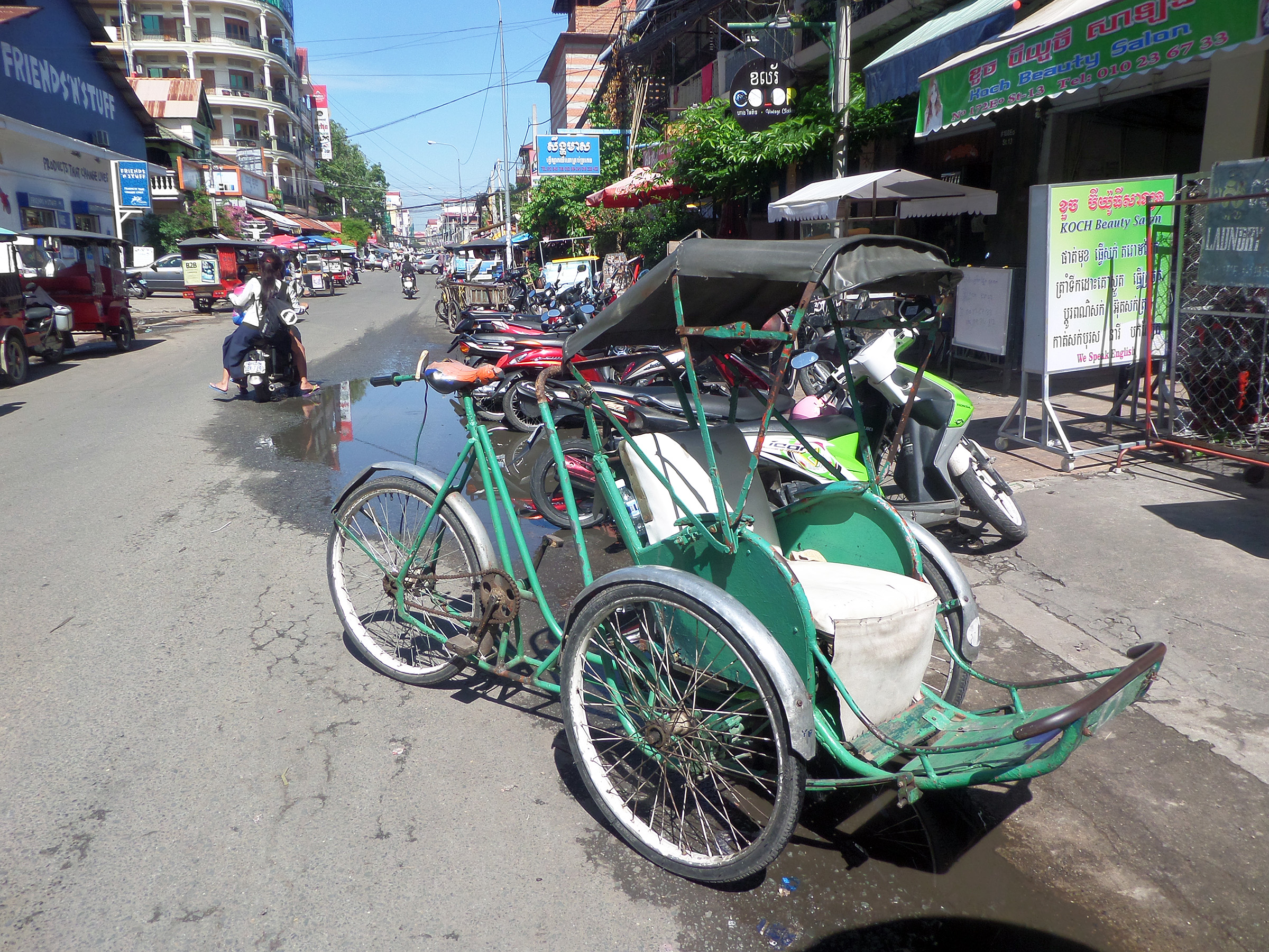 Parked cambodian cyclos photo