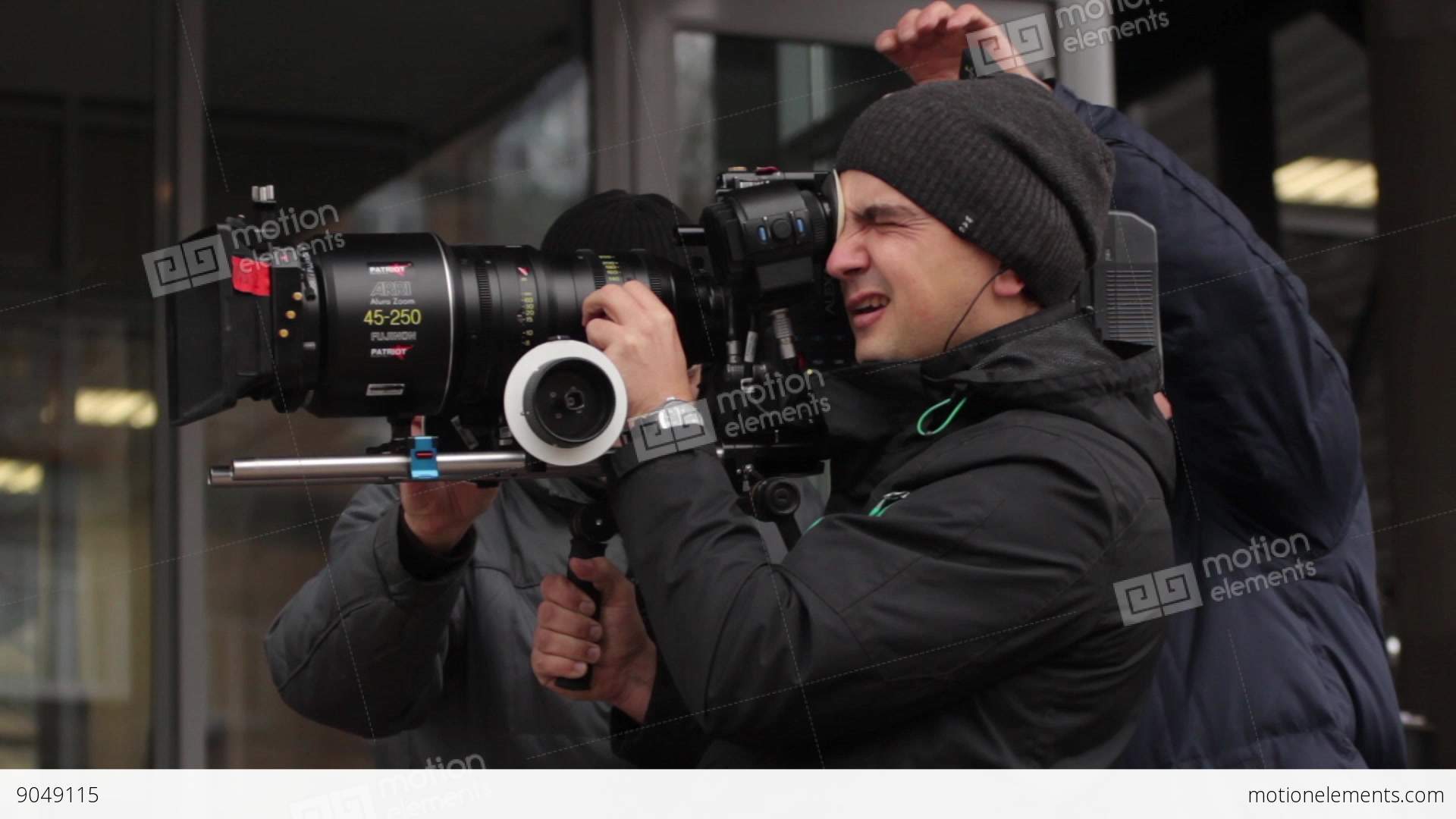 The Cameraman Shoots On A Professional Camera With Big Lens Stock ...