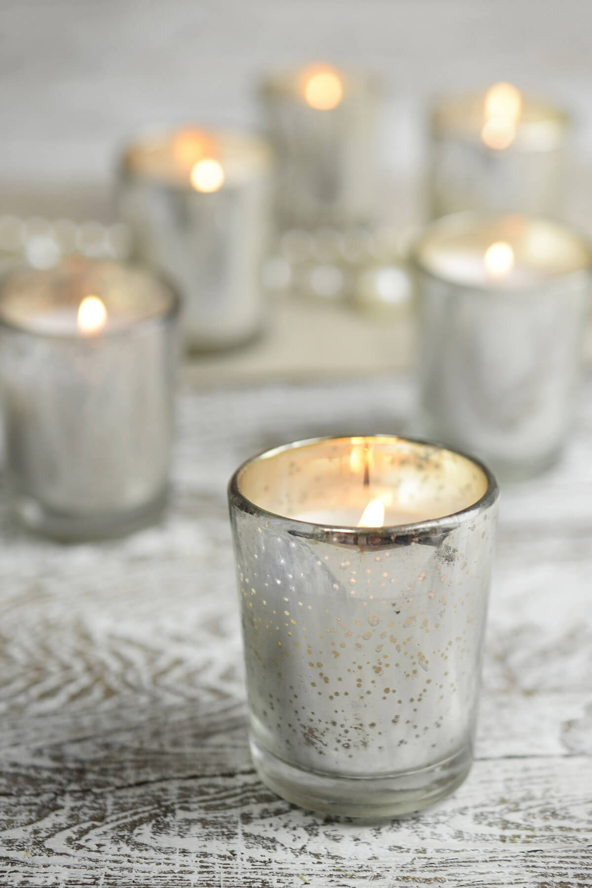 12 Candles and Silver Mercury Glass Votive Holders