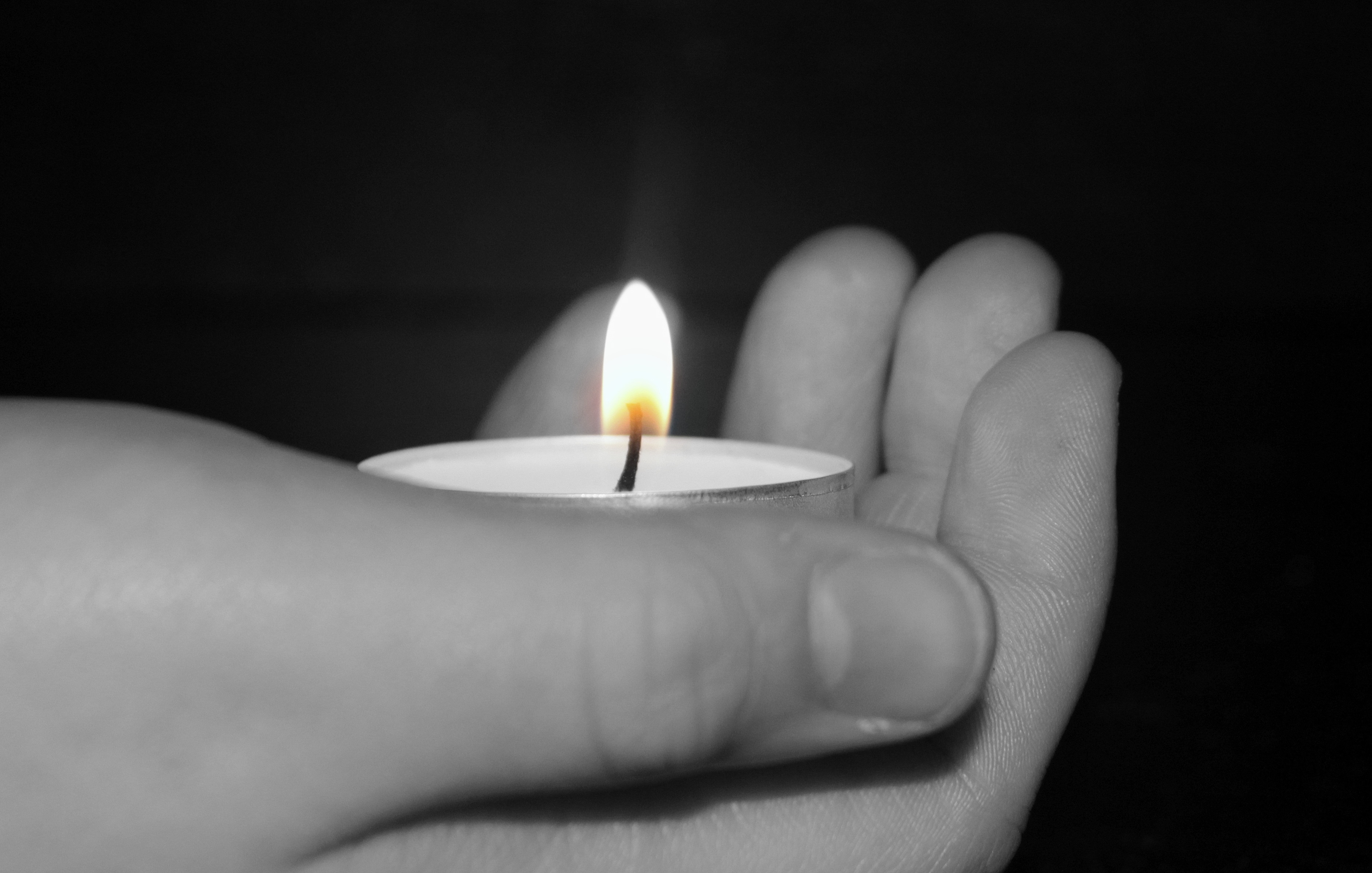 Candle in the hand photo