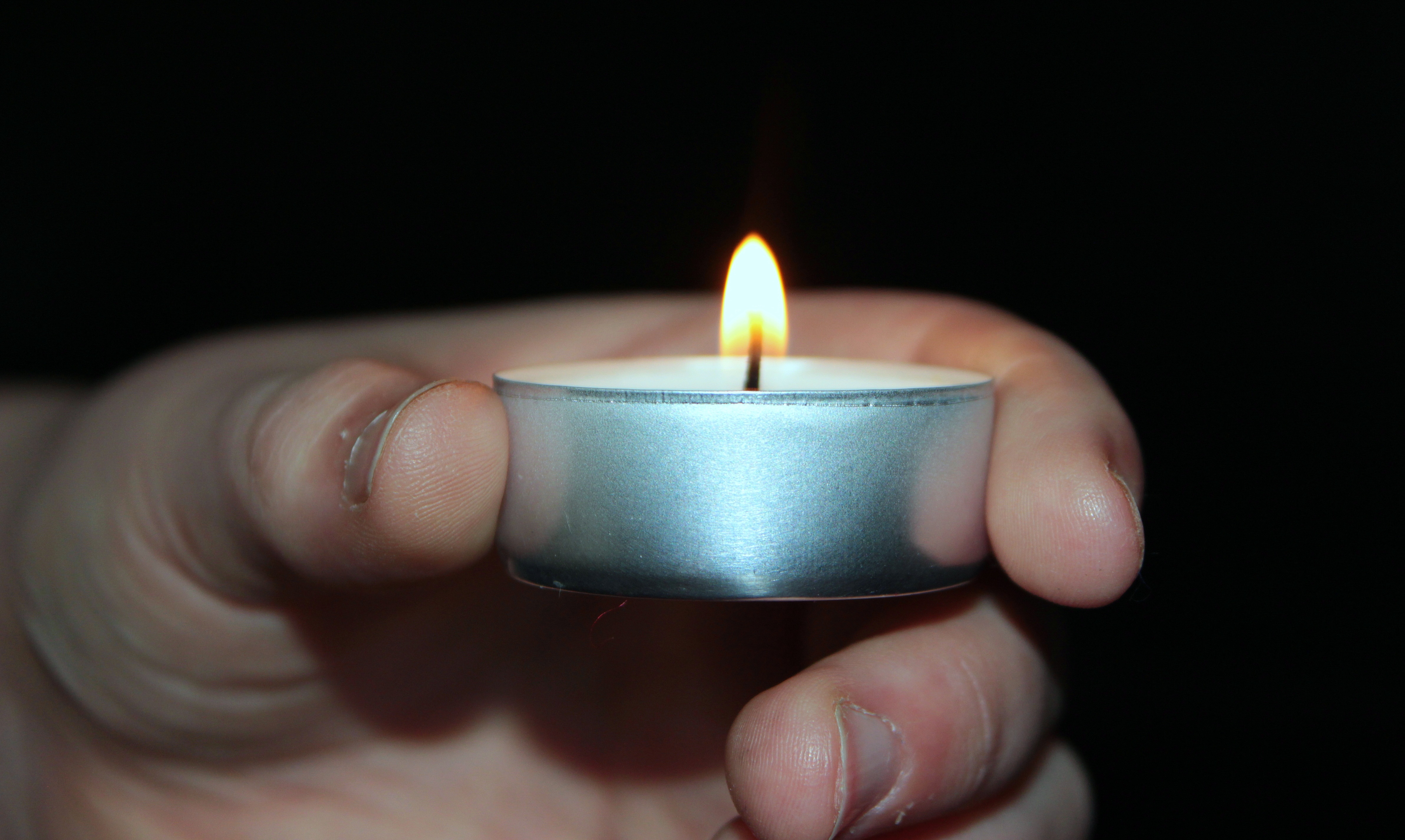 Candle in the hand photo