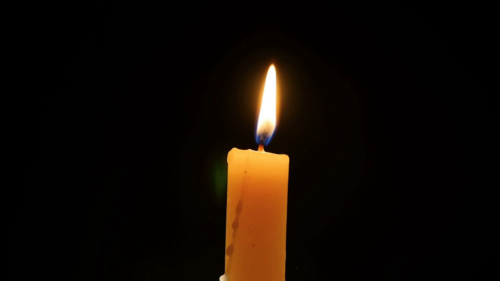 Burning Candle on a Dark Background Stock Video Footage - Videoblocks