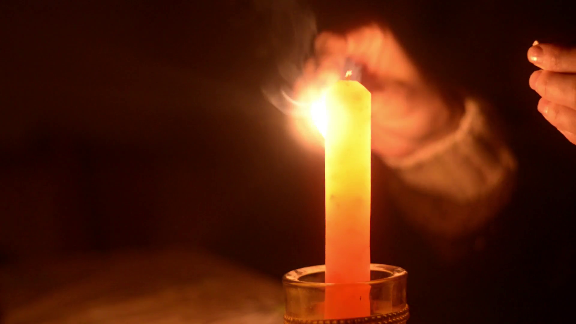 fire up the candle on the table Stock Video Footage - VideoBlocks