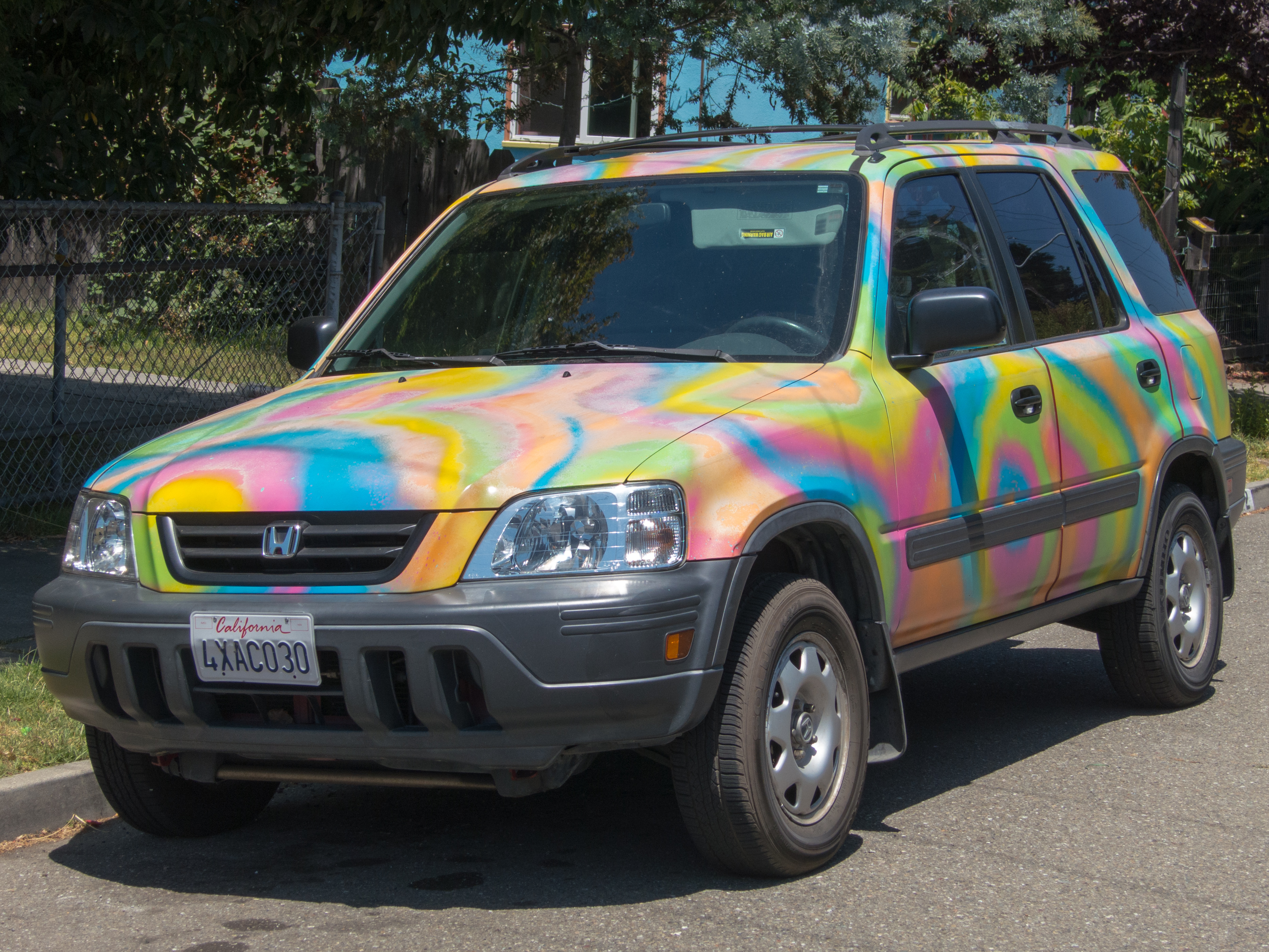 Car with colorful tye-dye paint job photo