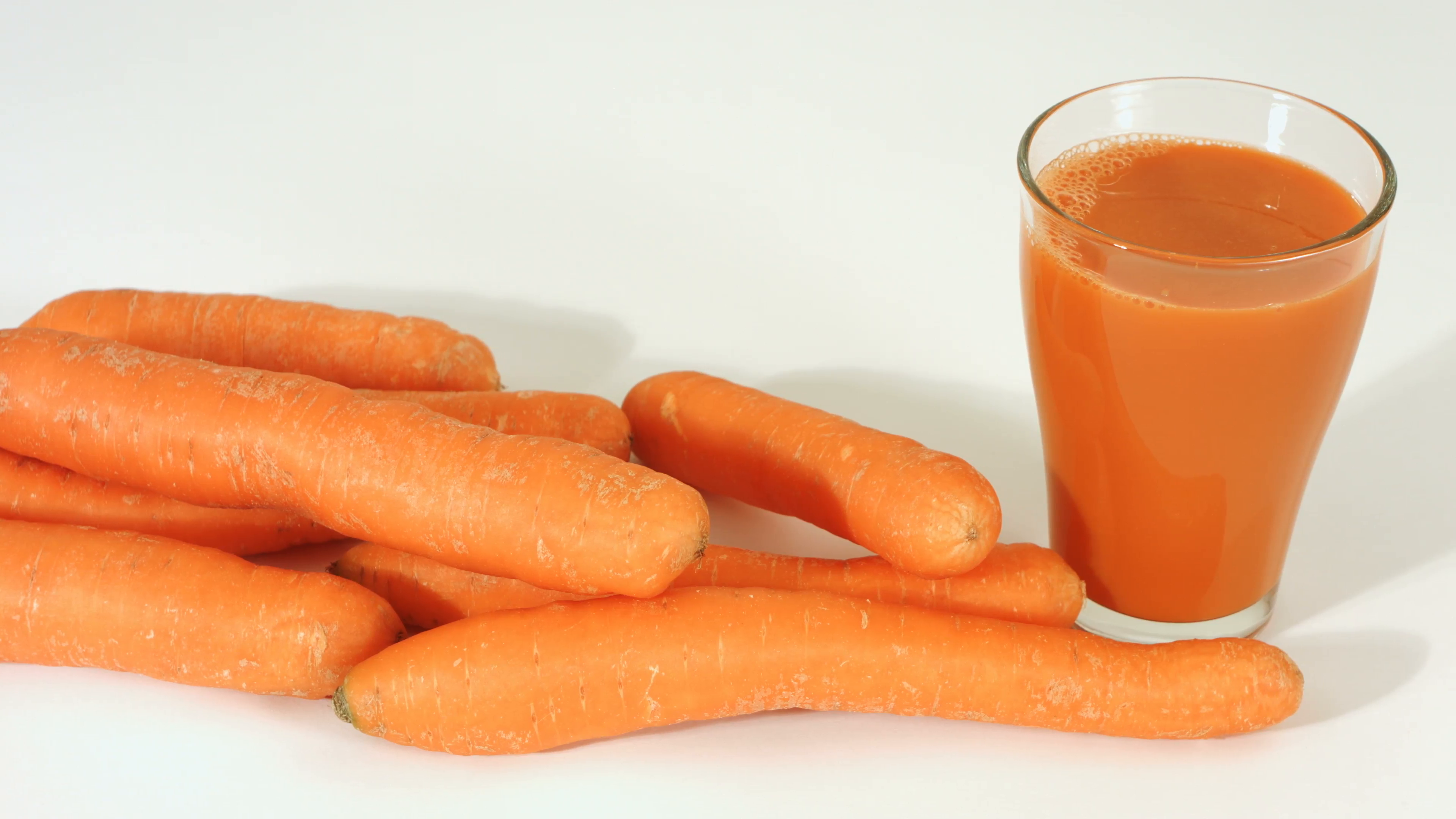 Glass of carrot juice and carrots Stock Video Footage - Videoblocks