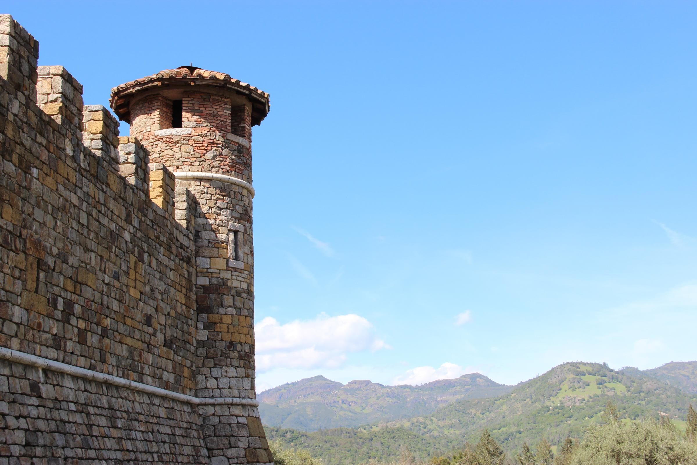 Free Stock Photo of Castle Wall & Tower by Mountains