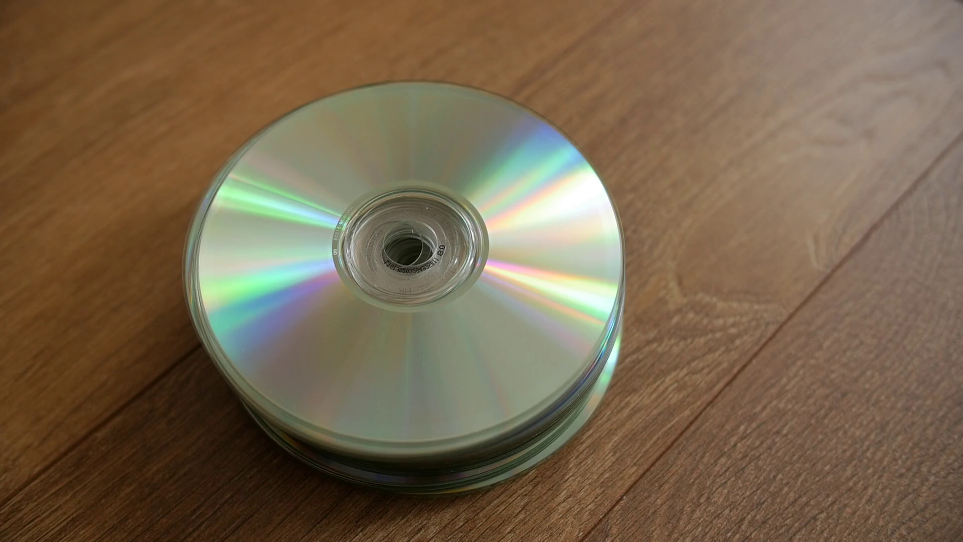 Closeup of a stack compact discs on wooden floor background. Cd ...