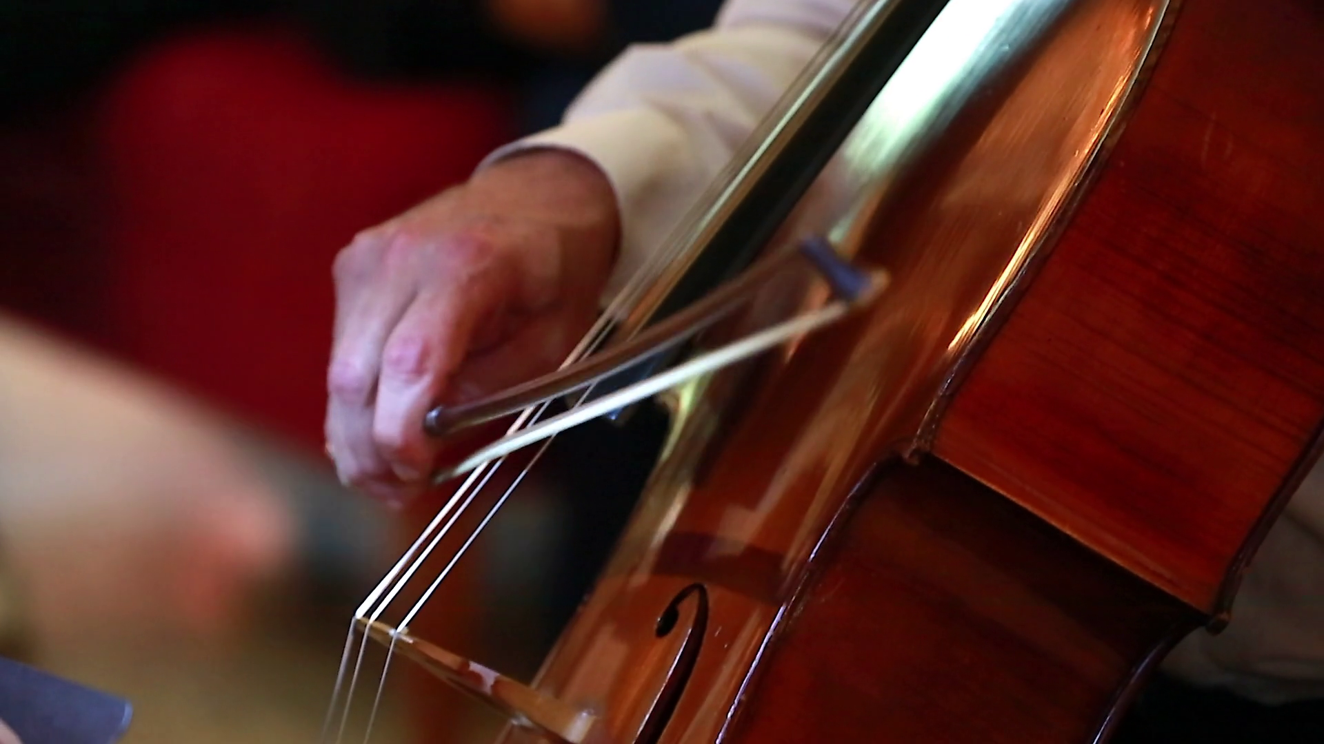 Man Hand Playing Violoncello With Cello Bow. Close up of Male Hand ...