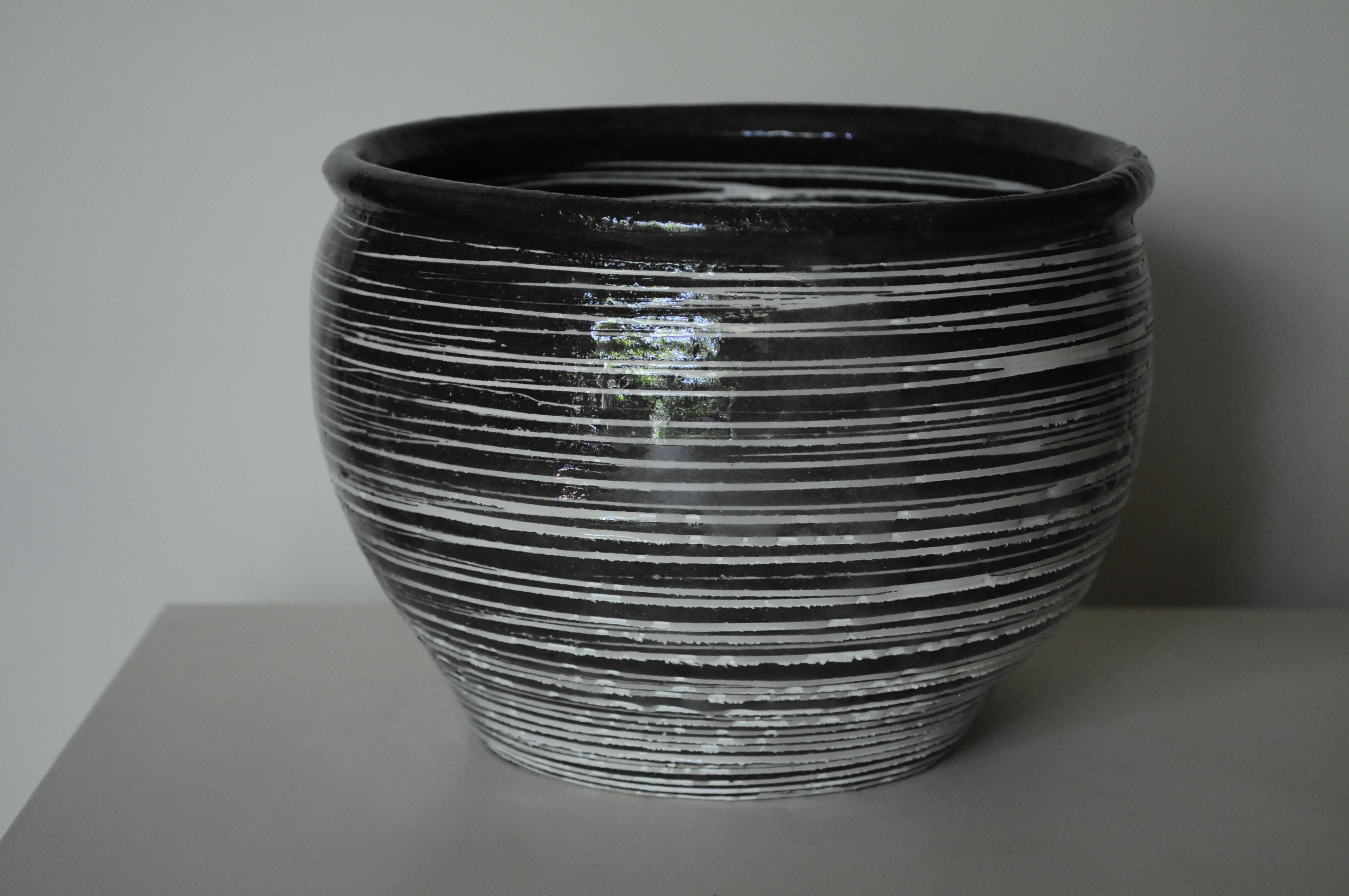 Black and white lidded pot, white stoneware, wheel-thrown, dark slip ...