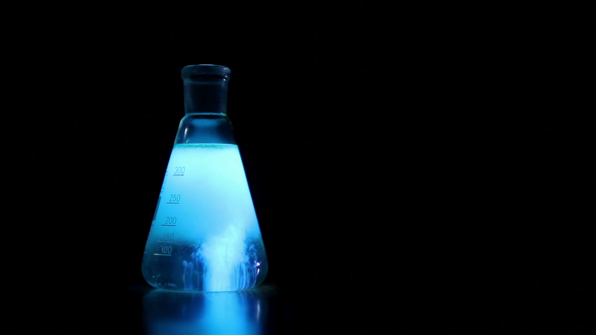 Chemical experience on black background, Fluorescent chemical ...