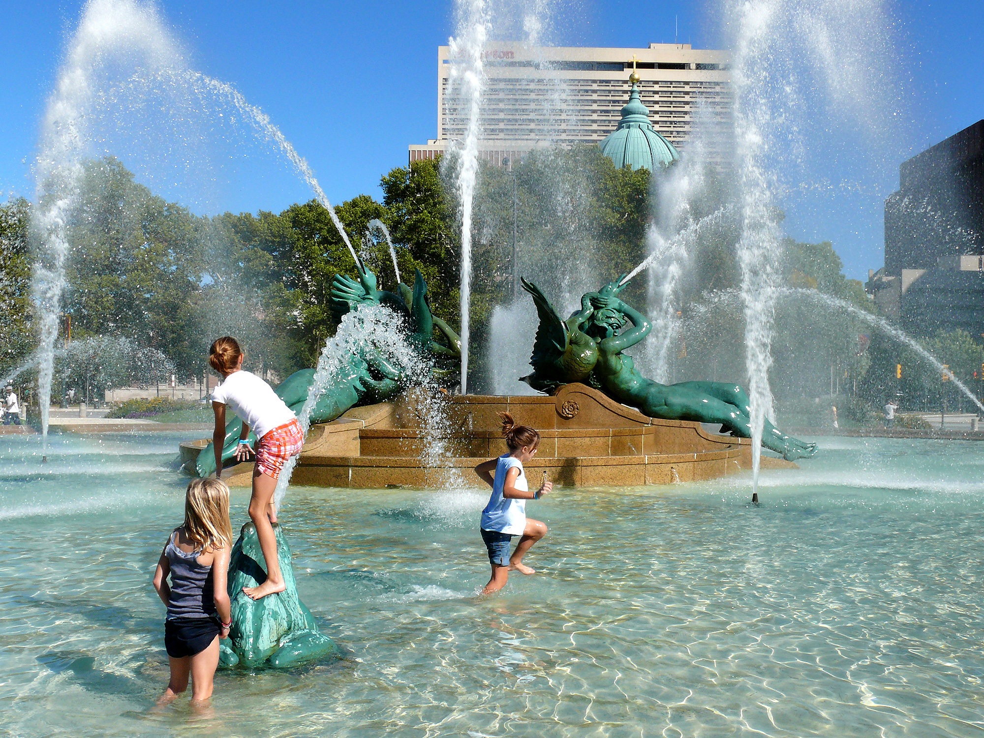 Children playing in the fountain photo