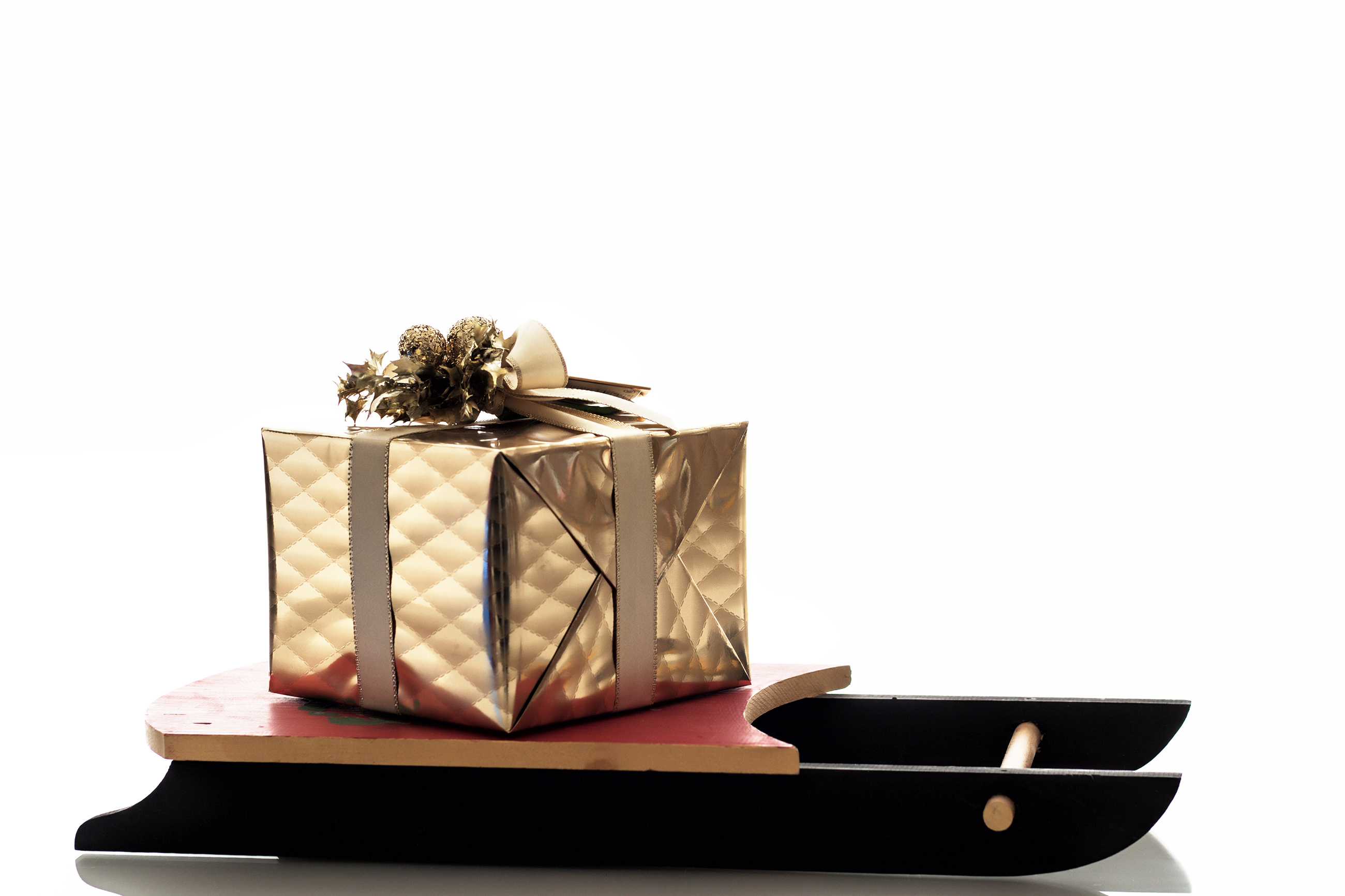 Christmas sledge with golden gift photo