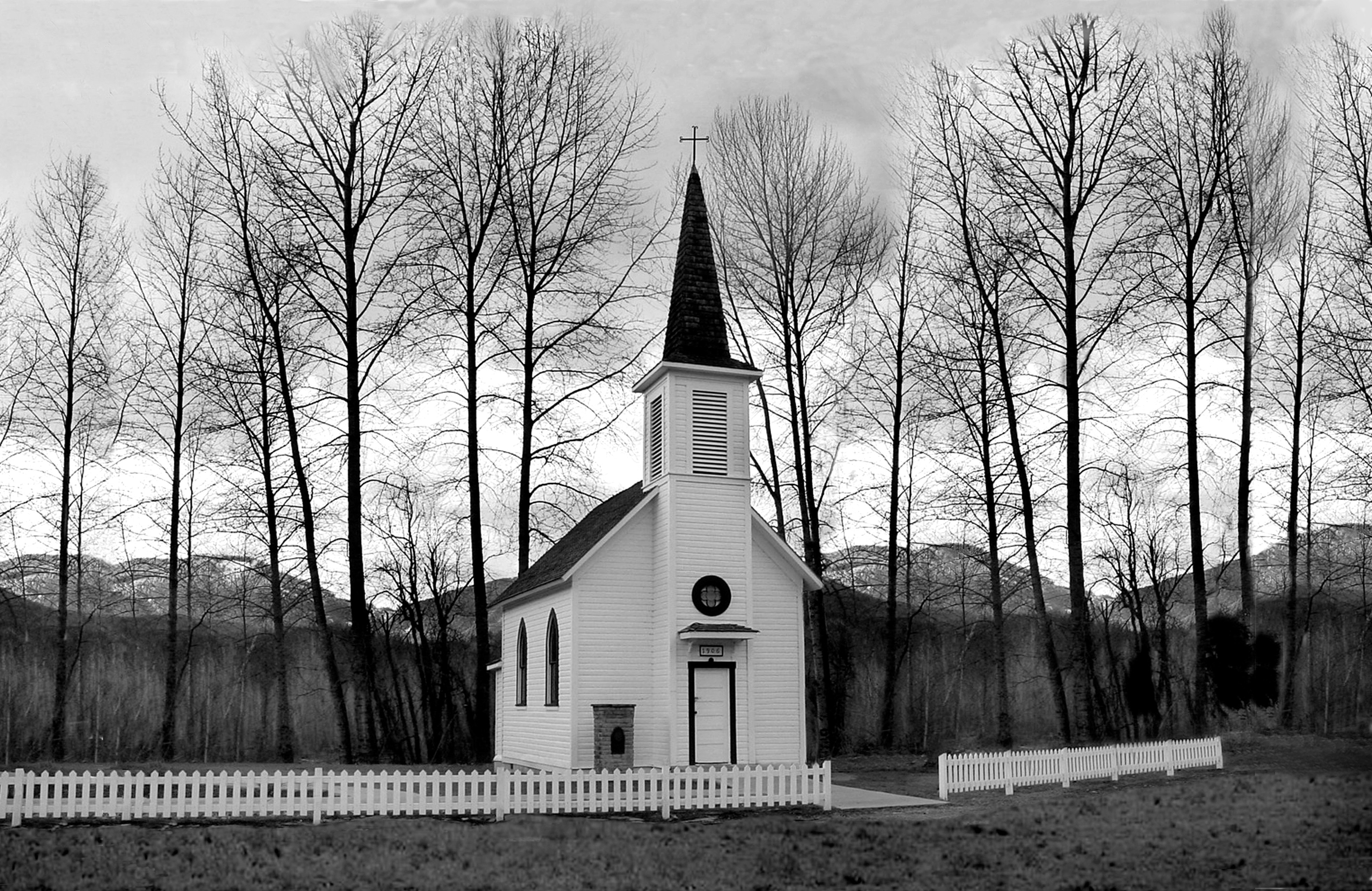 Church behind of bare trees photo