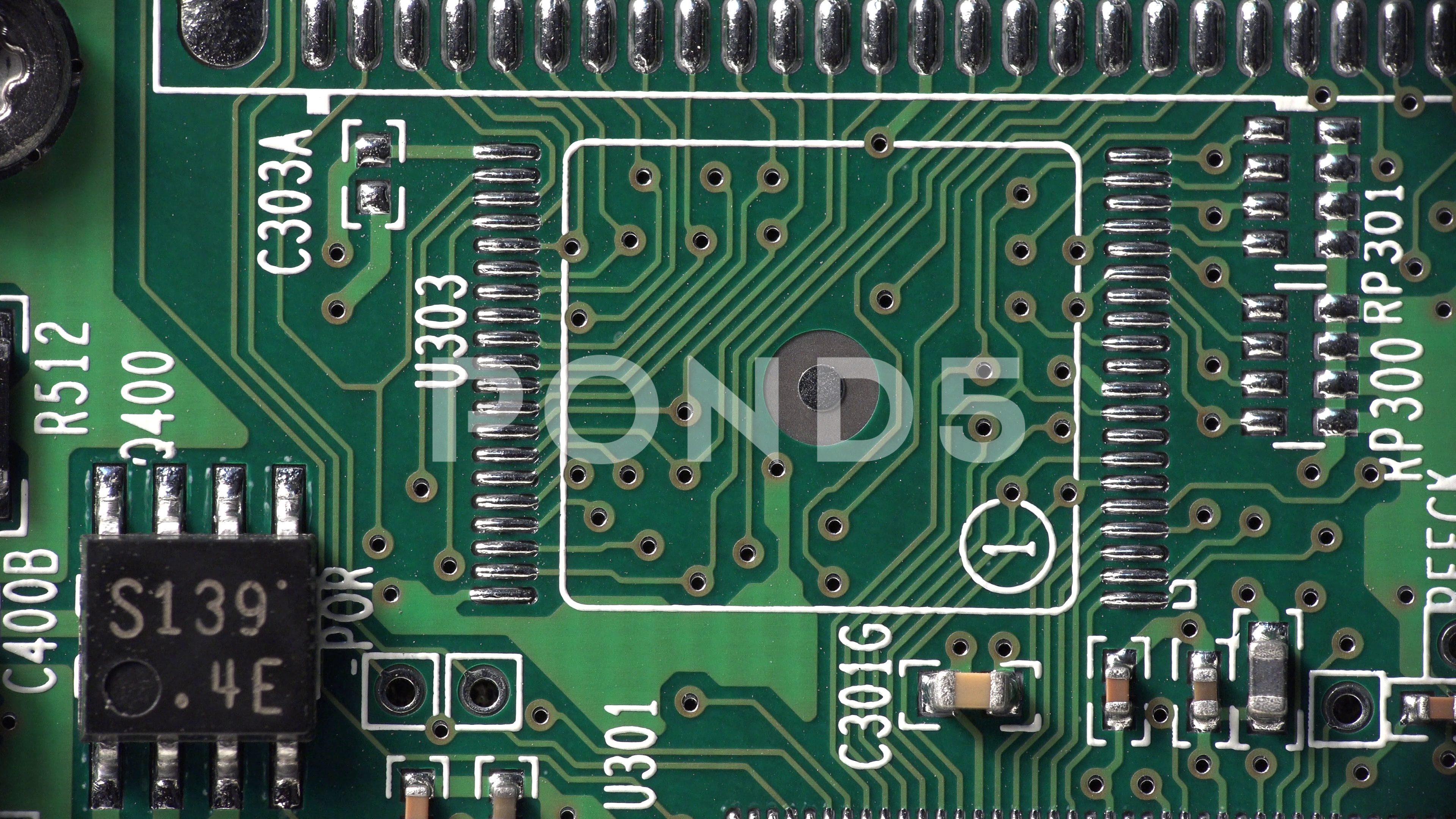 Closeup of an integrated circuit board from an assembled computer ...
