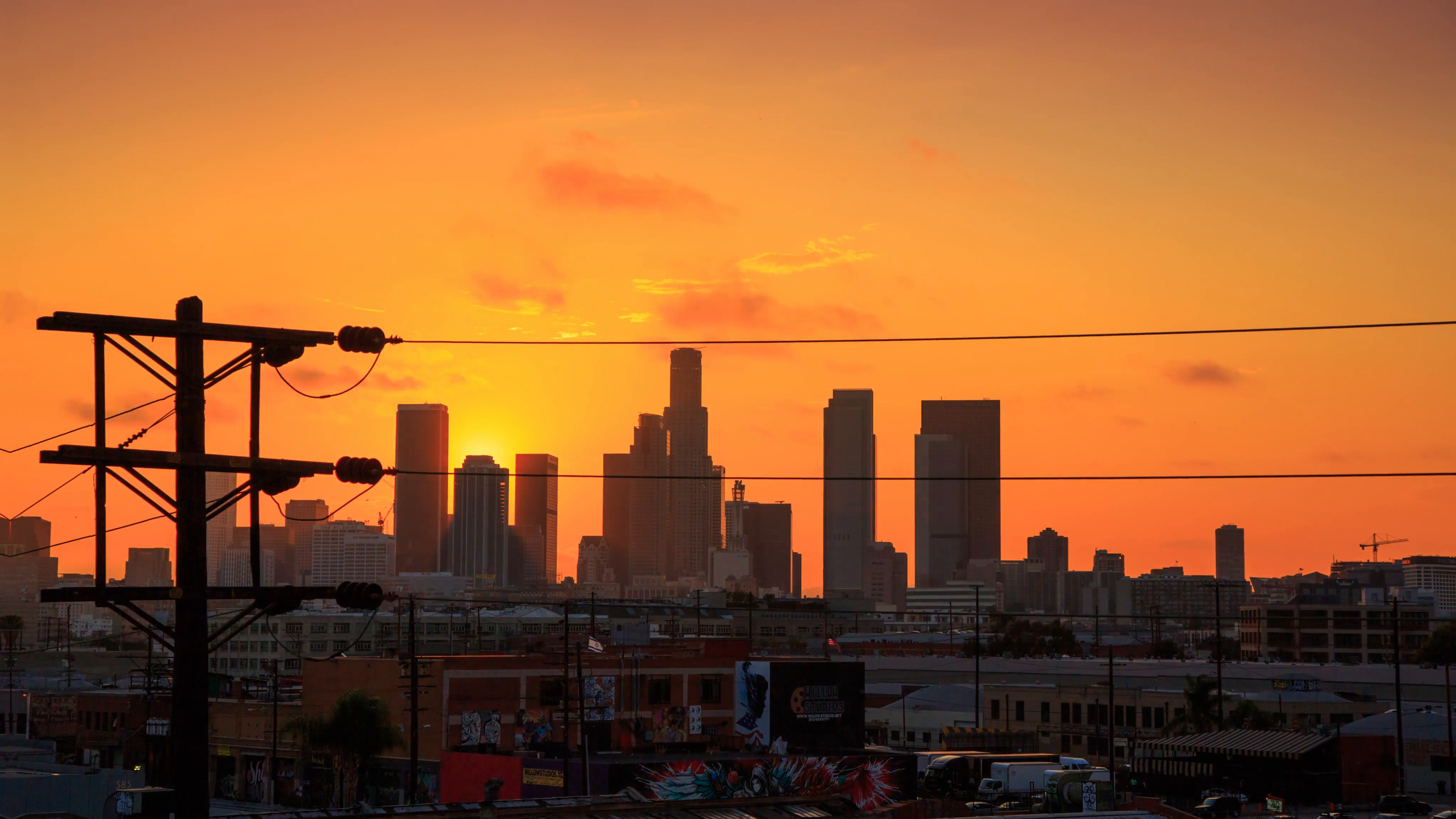 4K. Los Angeles city. Sunset sun over downtown LA skyline. Timelapse ...