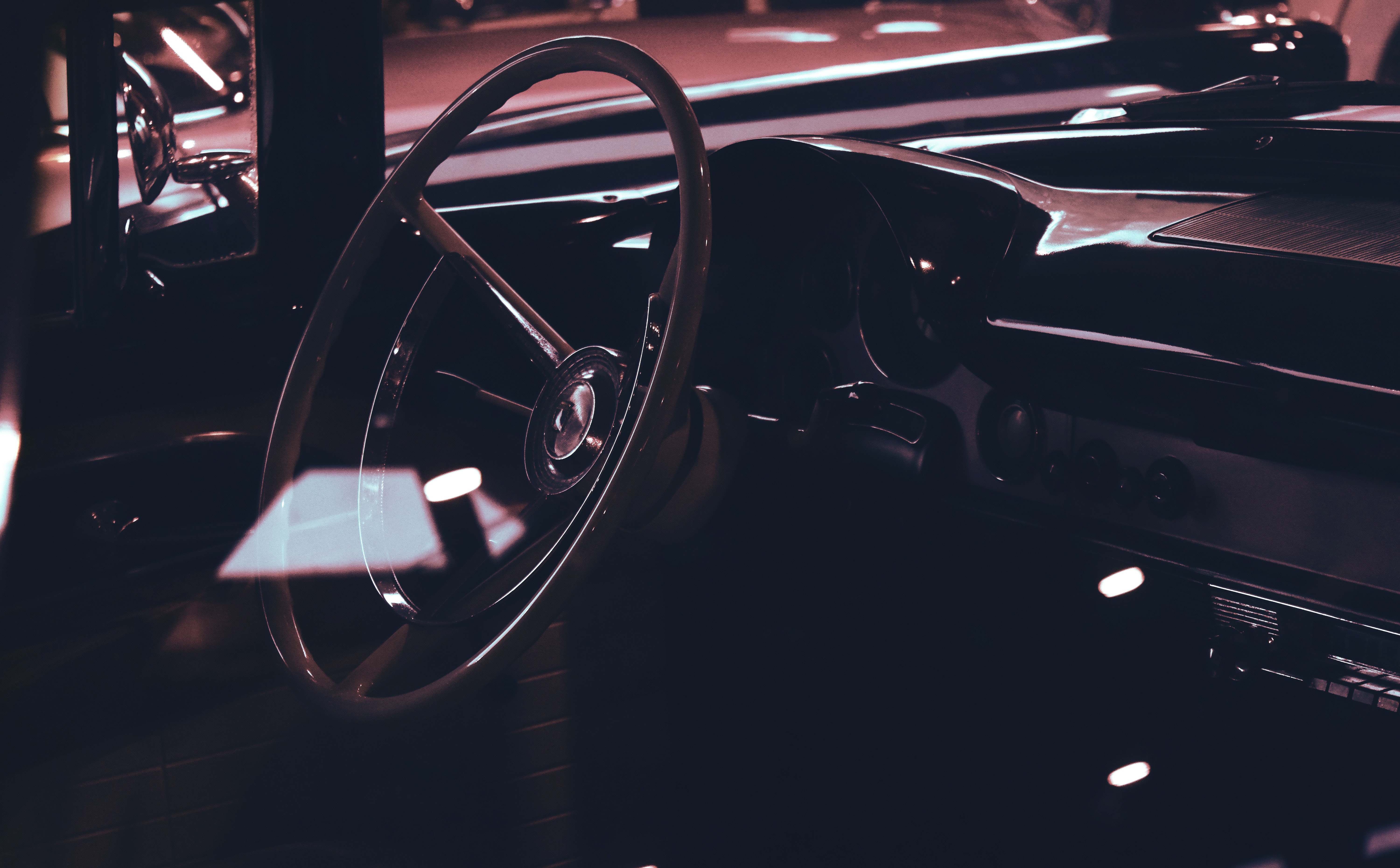 Classic car interior showing wooden steering wheel photo