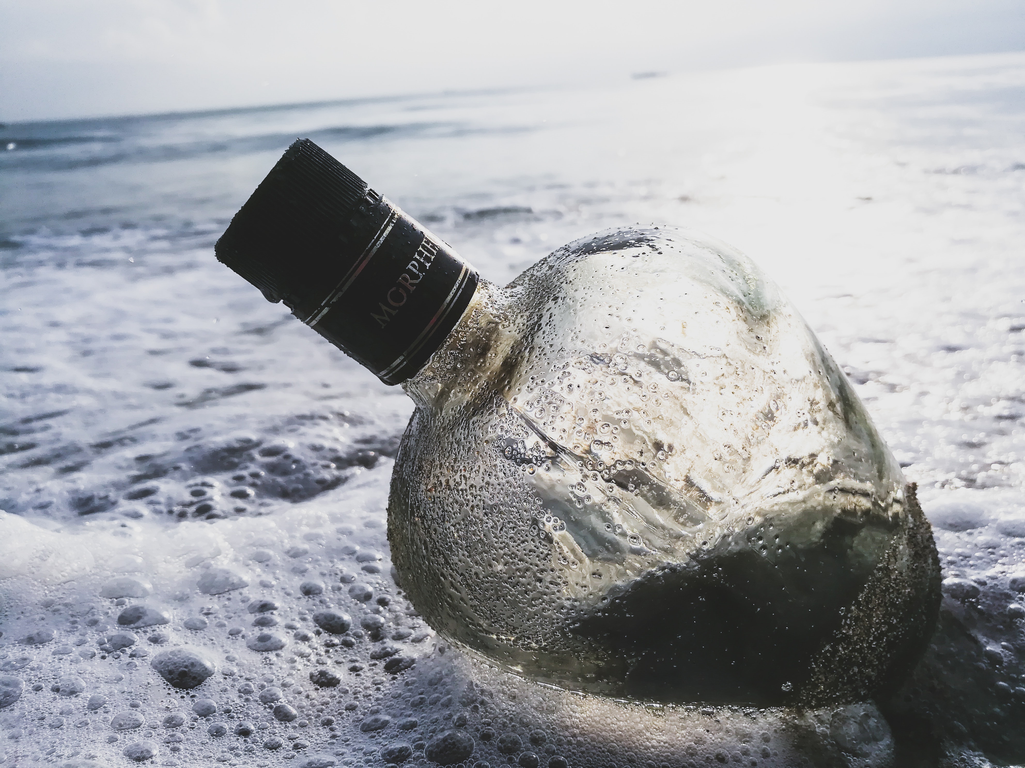 Clear Glass Bottle on Body of Water, Alcohol, Sand, Travel, Shore, HQ Photo
