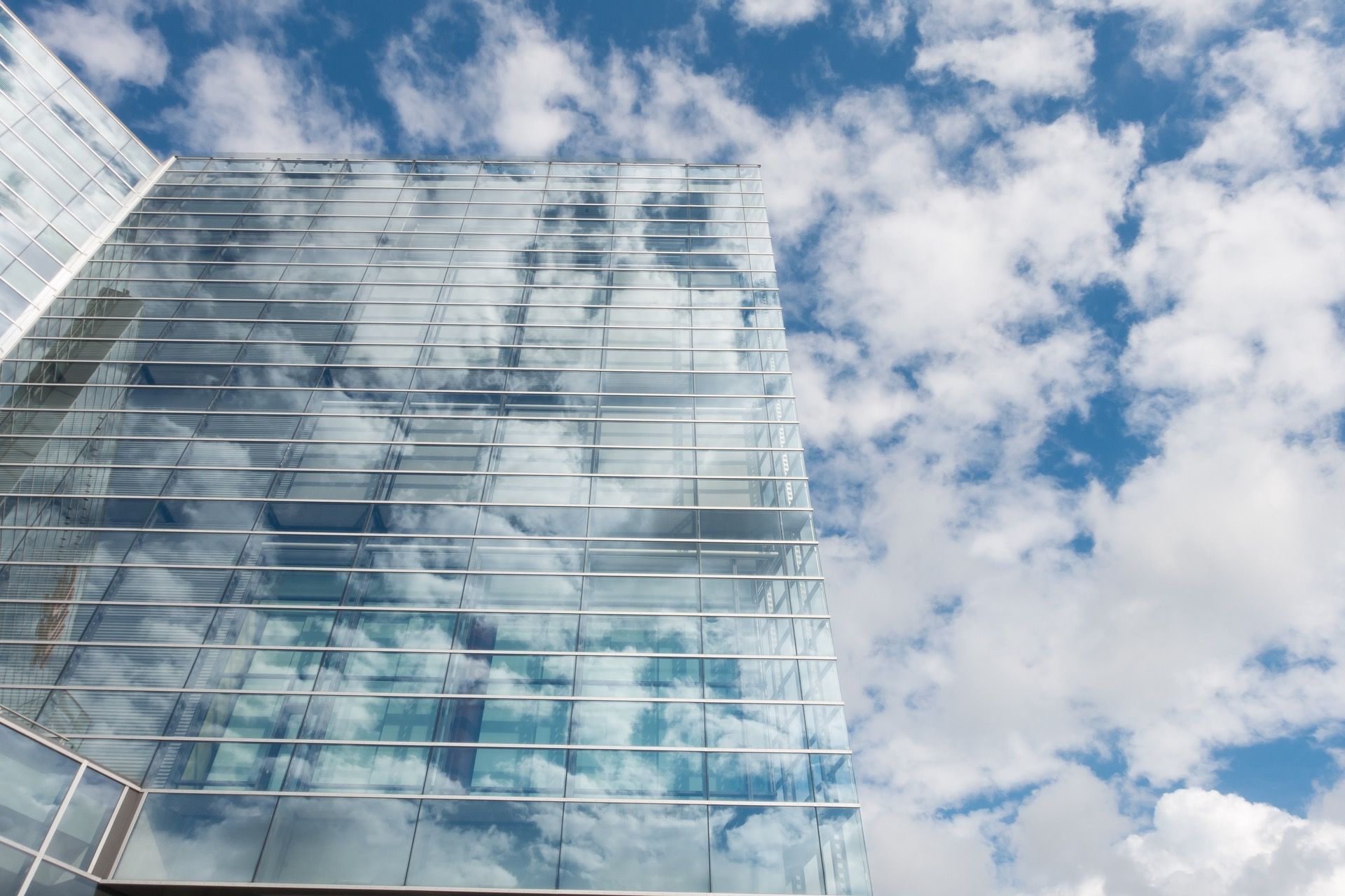 Bottom View of Clear Glass Building Under Blue Cloudy Sky during Day ...