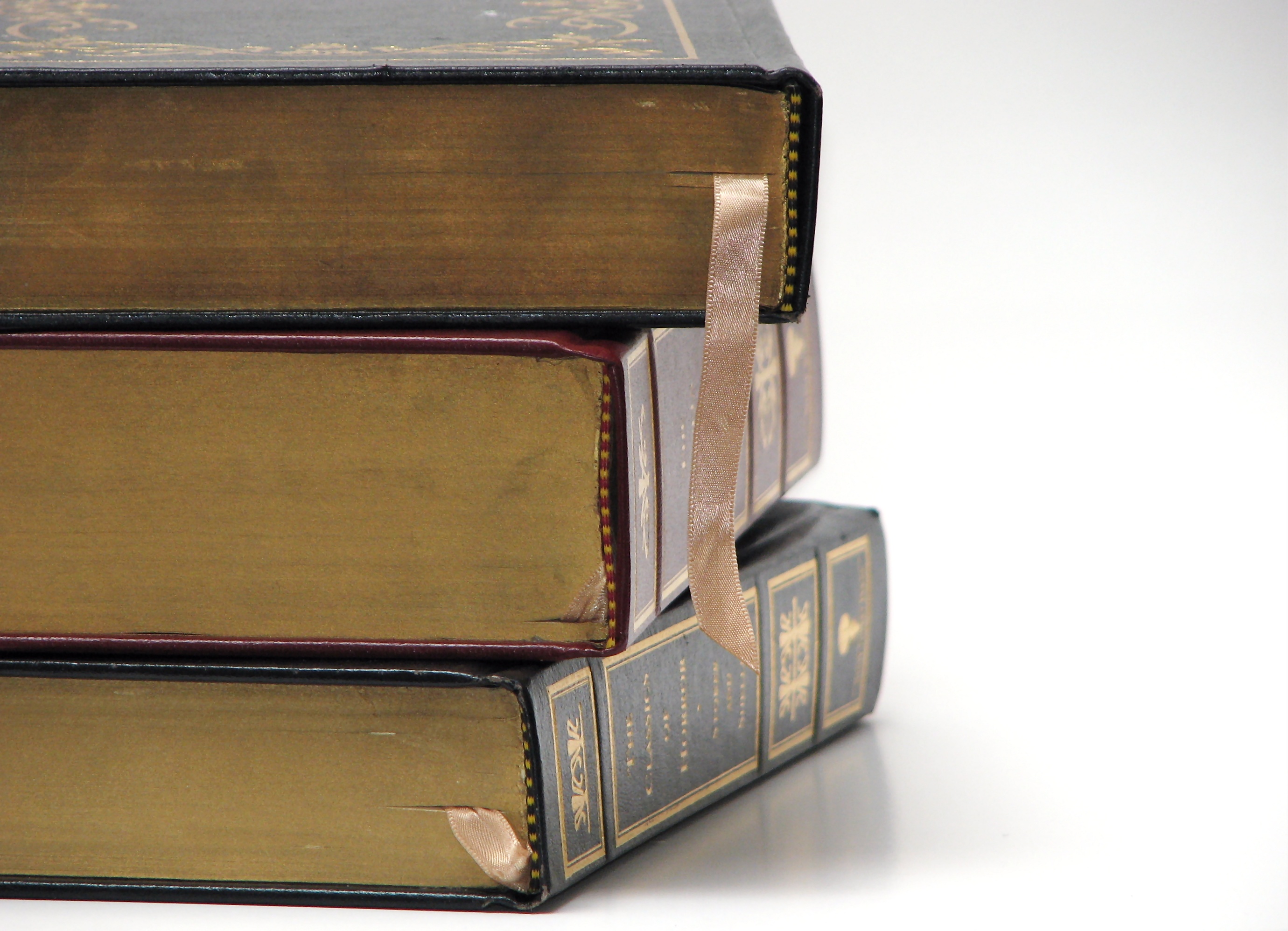 Close-up of antique books on a white bac photo