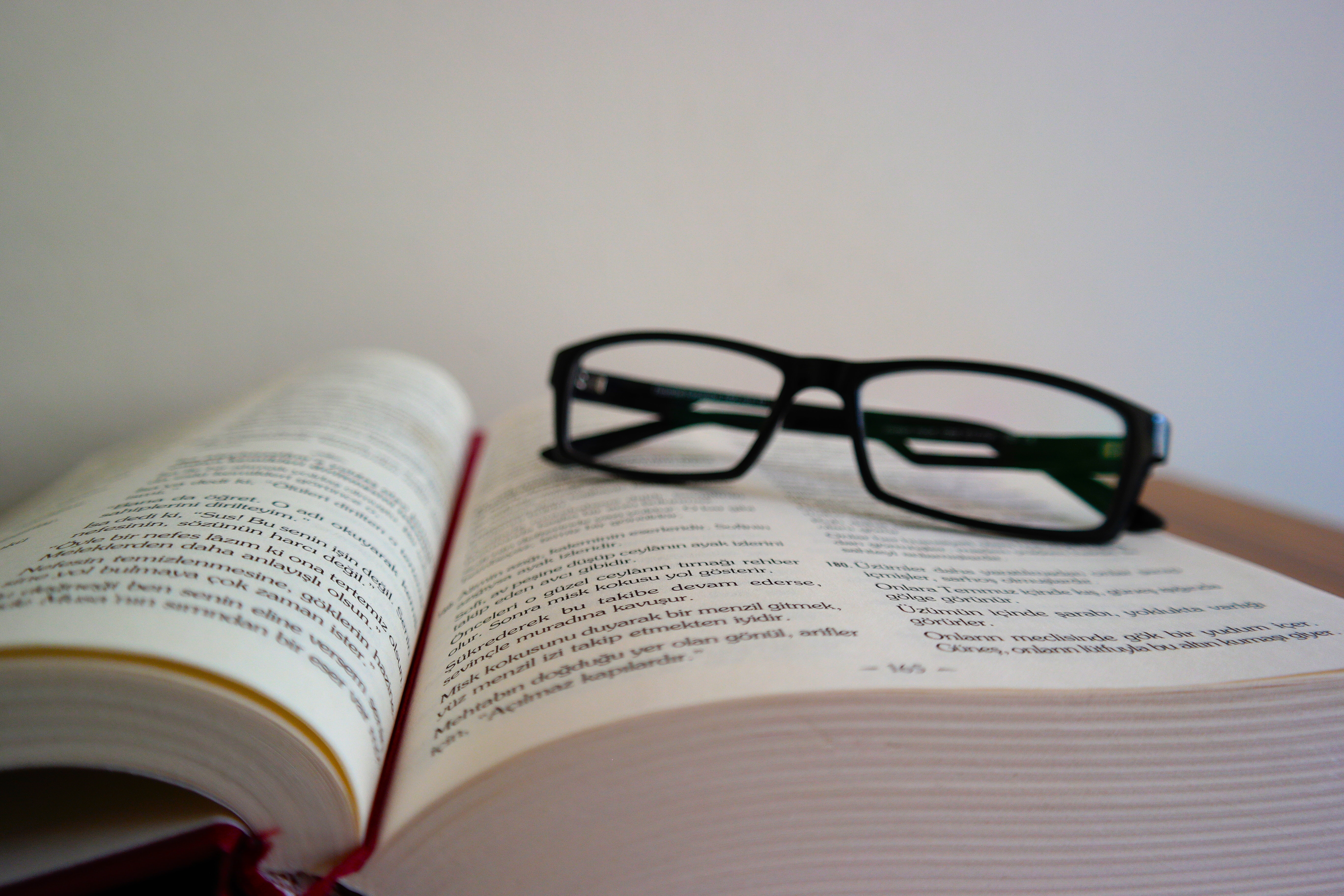 Close-up of eyeglasses on book photo
