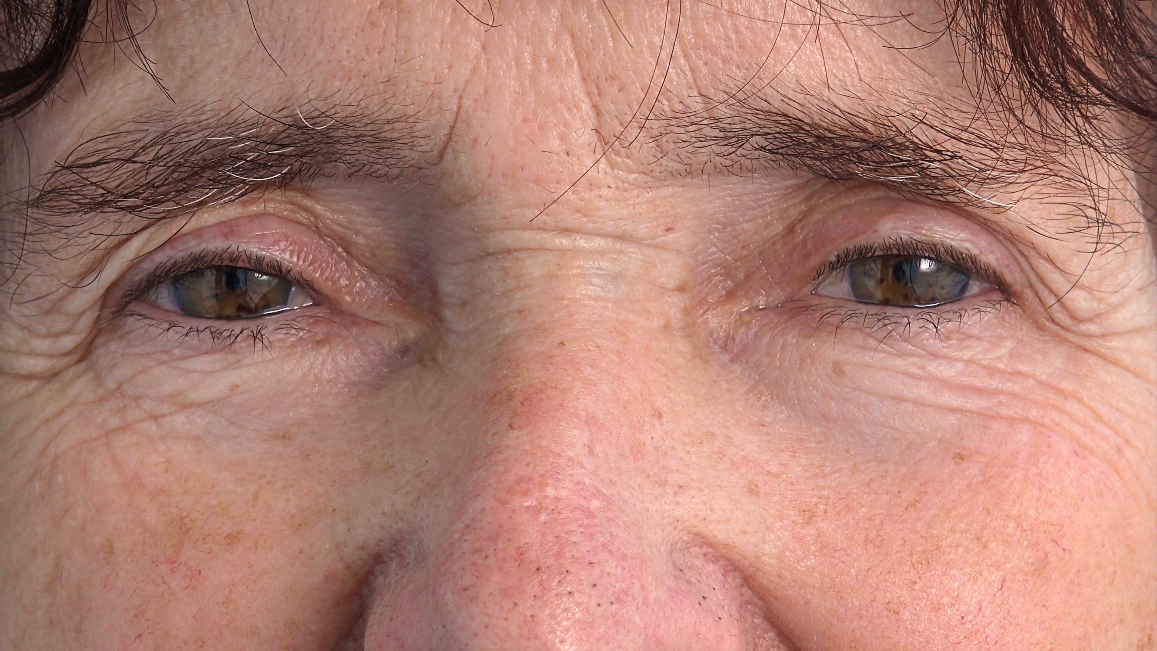 Loneliness. Closeup on the eyes and wrinkles of elderly woman. Stock ...