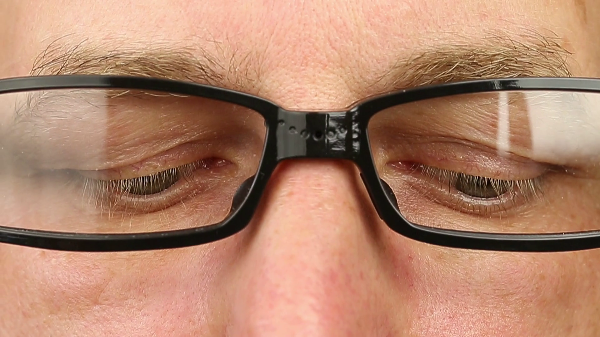 Adult man in eyeglasses extremely close-up view. Thinking looking ...