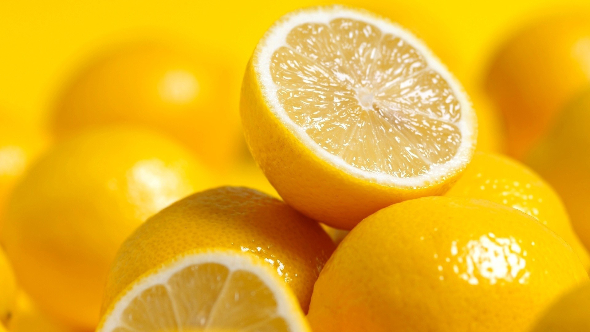 Close-up of Lemons, one Sliced in Half | FRUITS