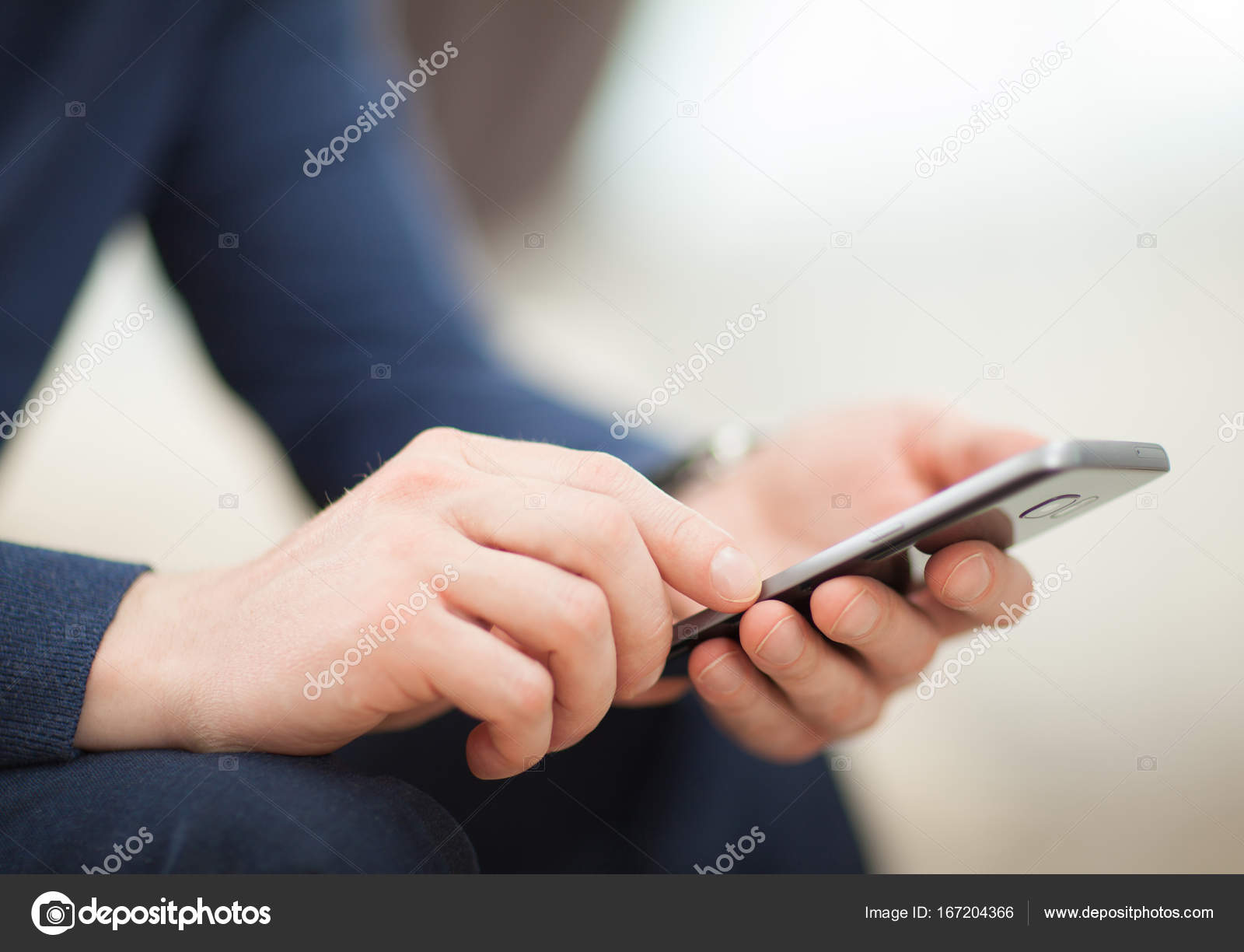 Close-up of man using mobile phone photo