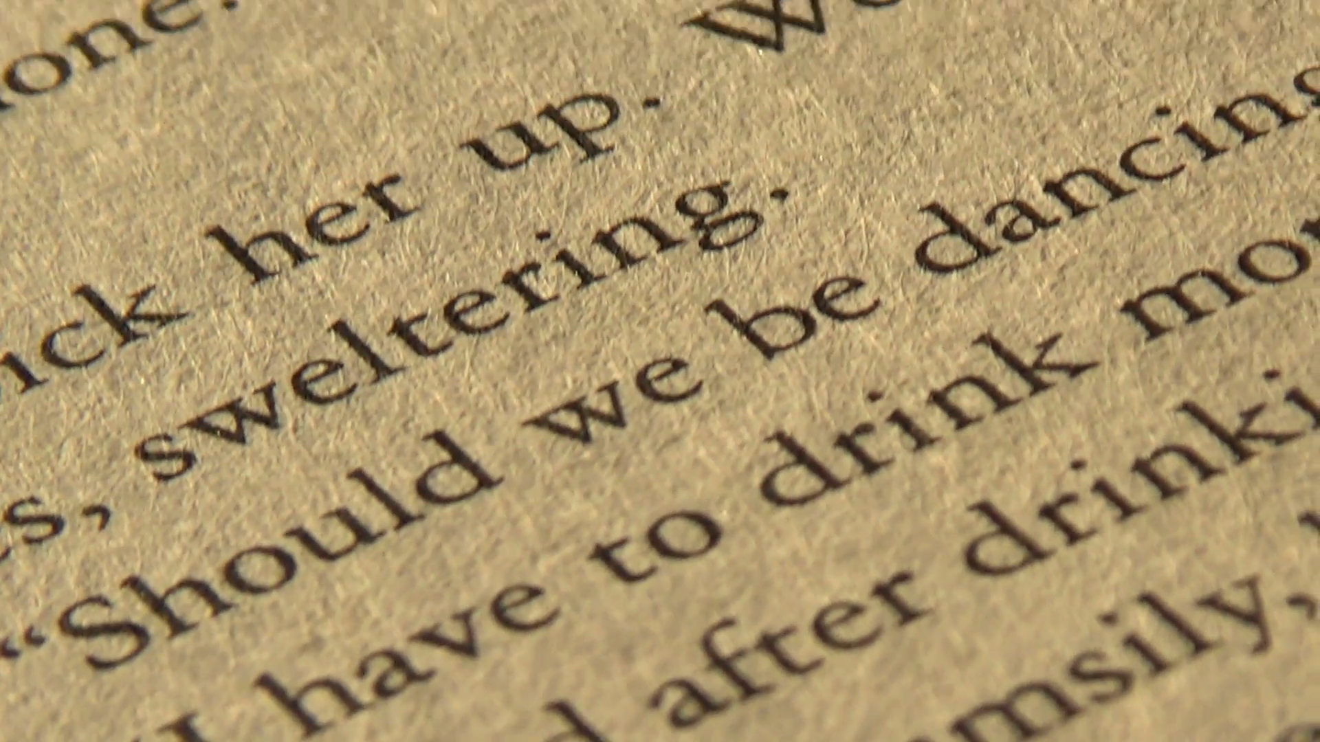 Closeup vertical pan of printed words on a book page Stock Video ...