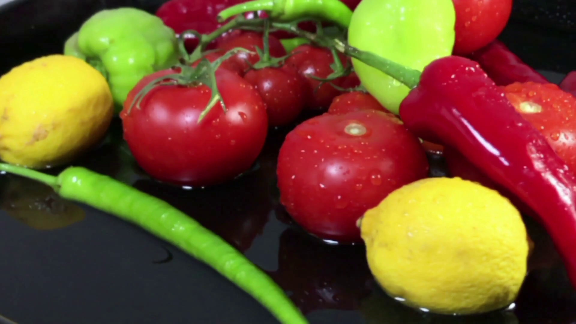 Fresh vegetables close up dolly shoot black background Stock Video ...