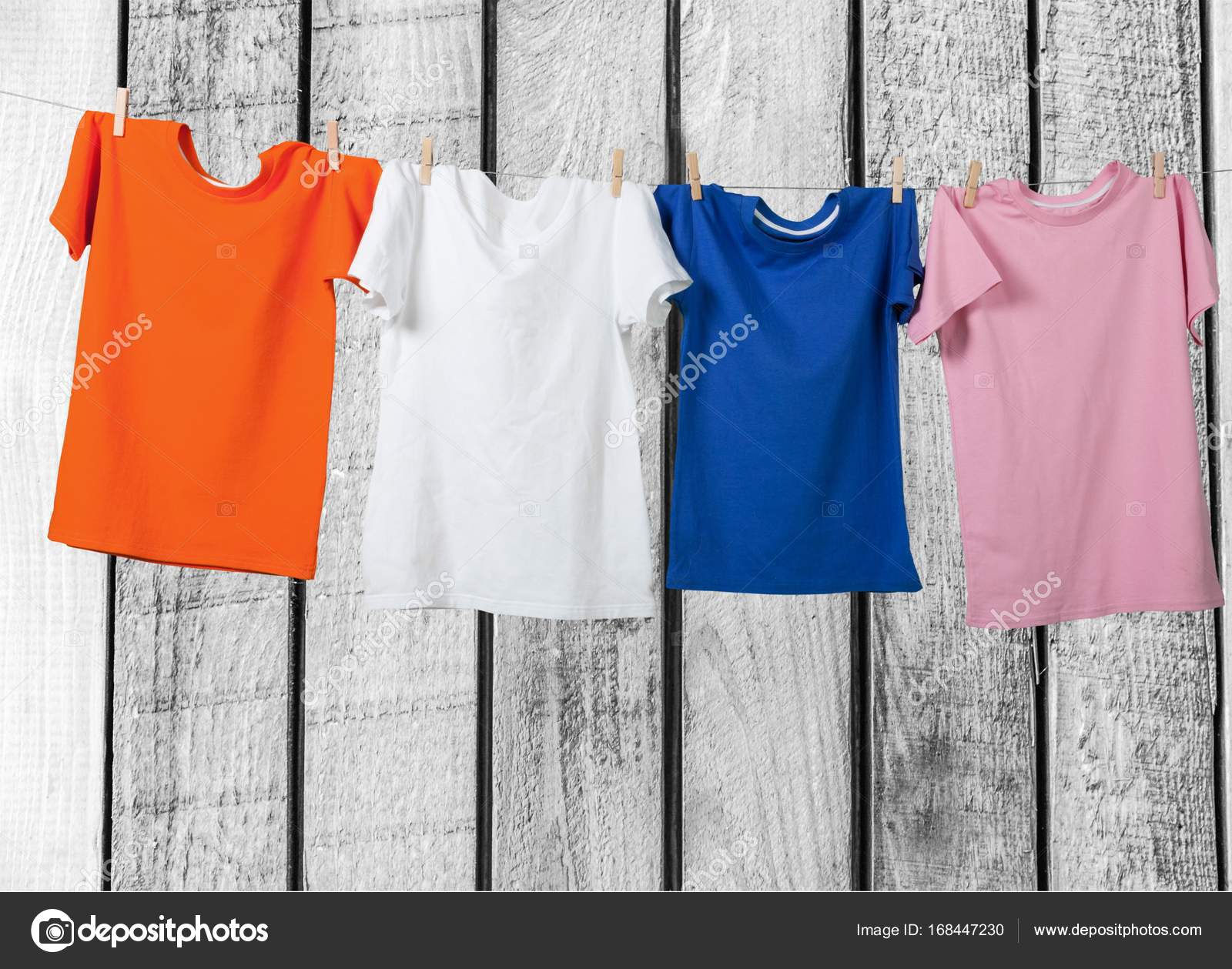 Colorful t-shirts hanging on rope — Stock Photo © billiondigital ...