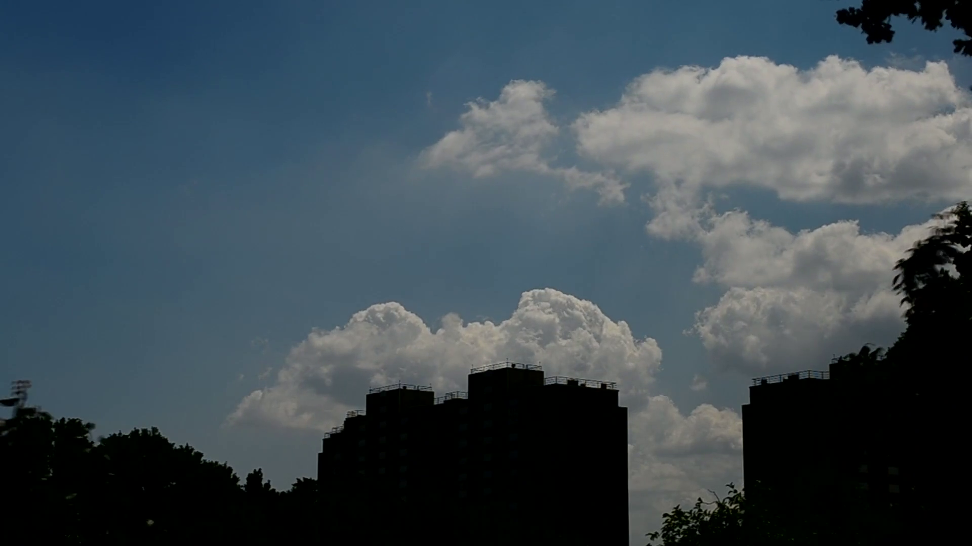 Time lapse of scenic white cumulus clouds bubbling and boiling above ...