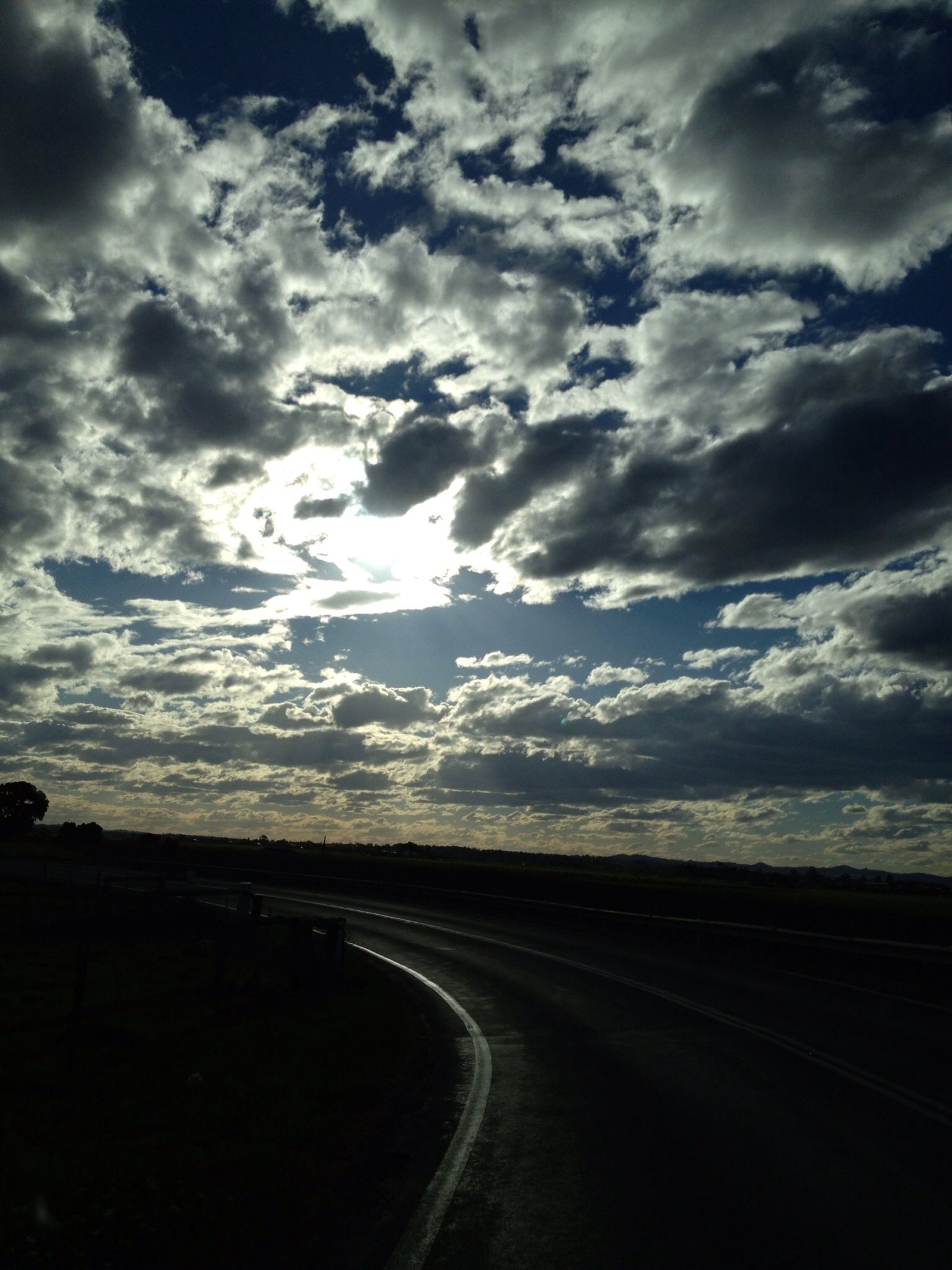 Clouds with light behind taken while driving- gotta love the iPhone ...