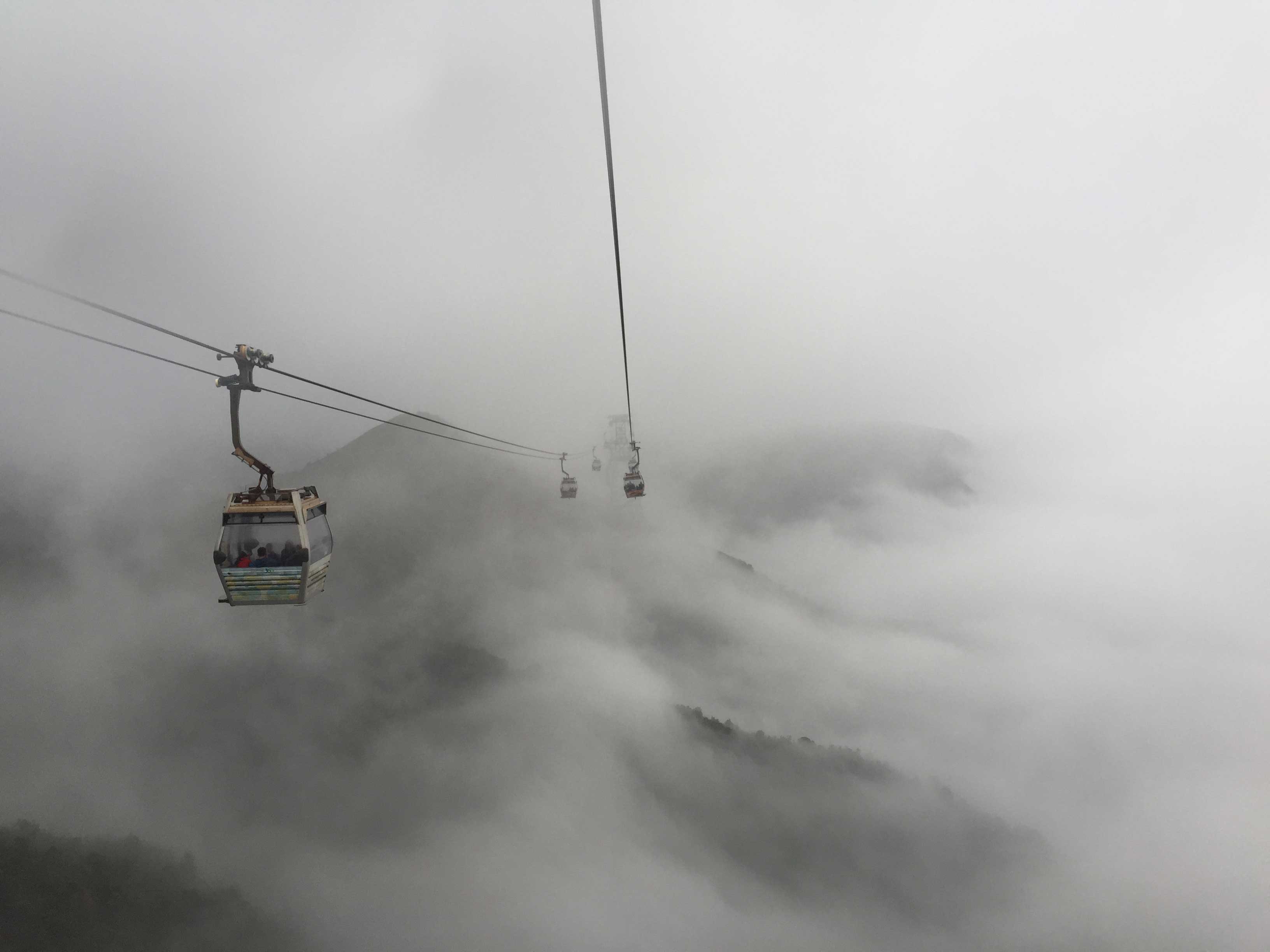 Mystic Ngong Ping 360 Cable Car during a cloudy and foggy day ...