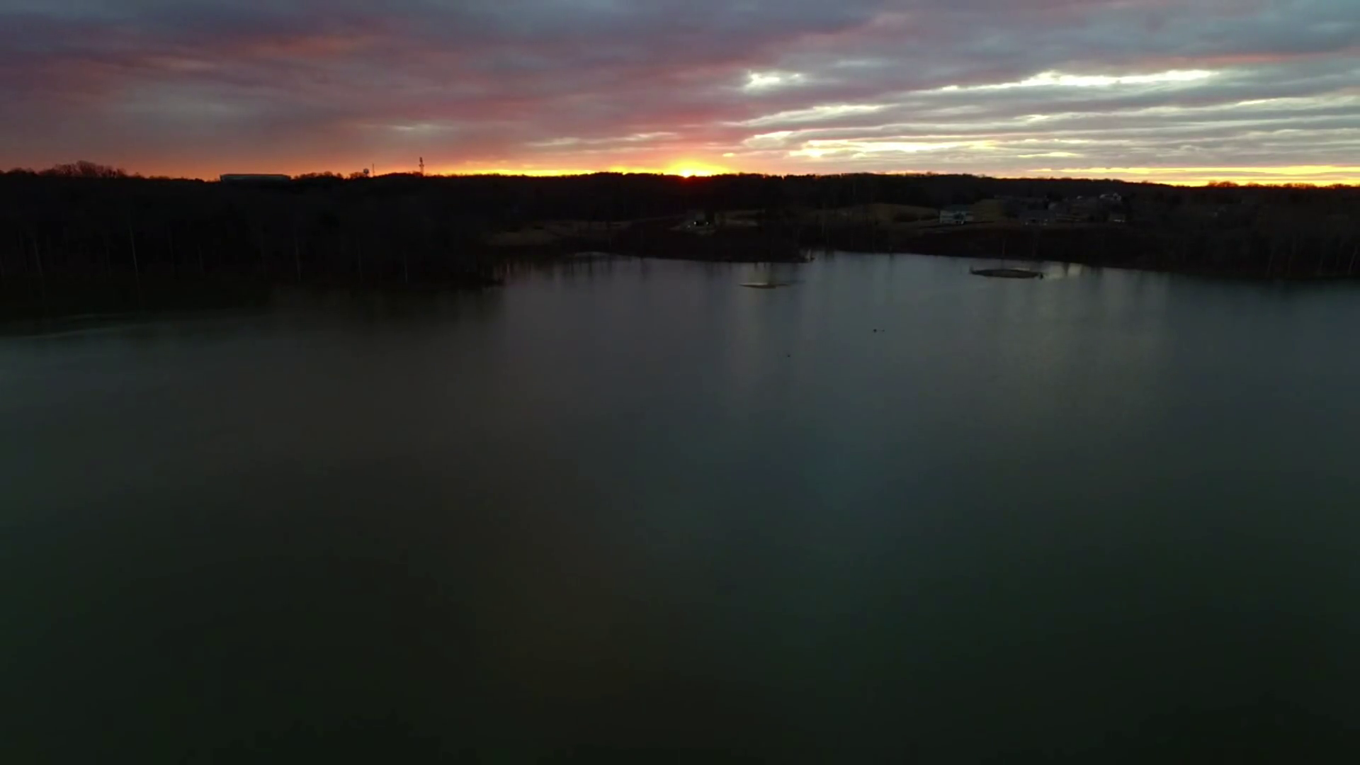 cloudy sunrise over water reflections Stock Video Footage - Videoblocks