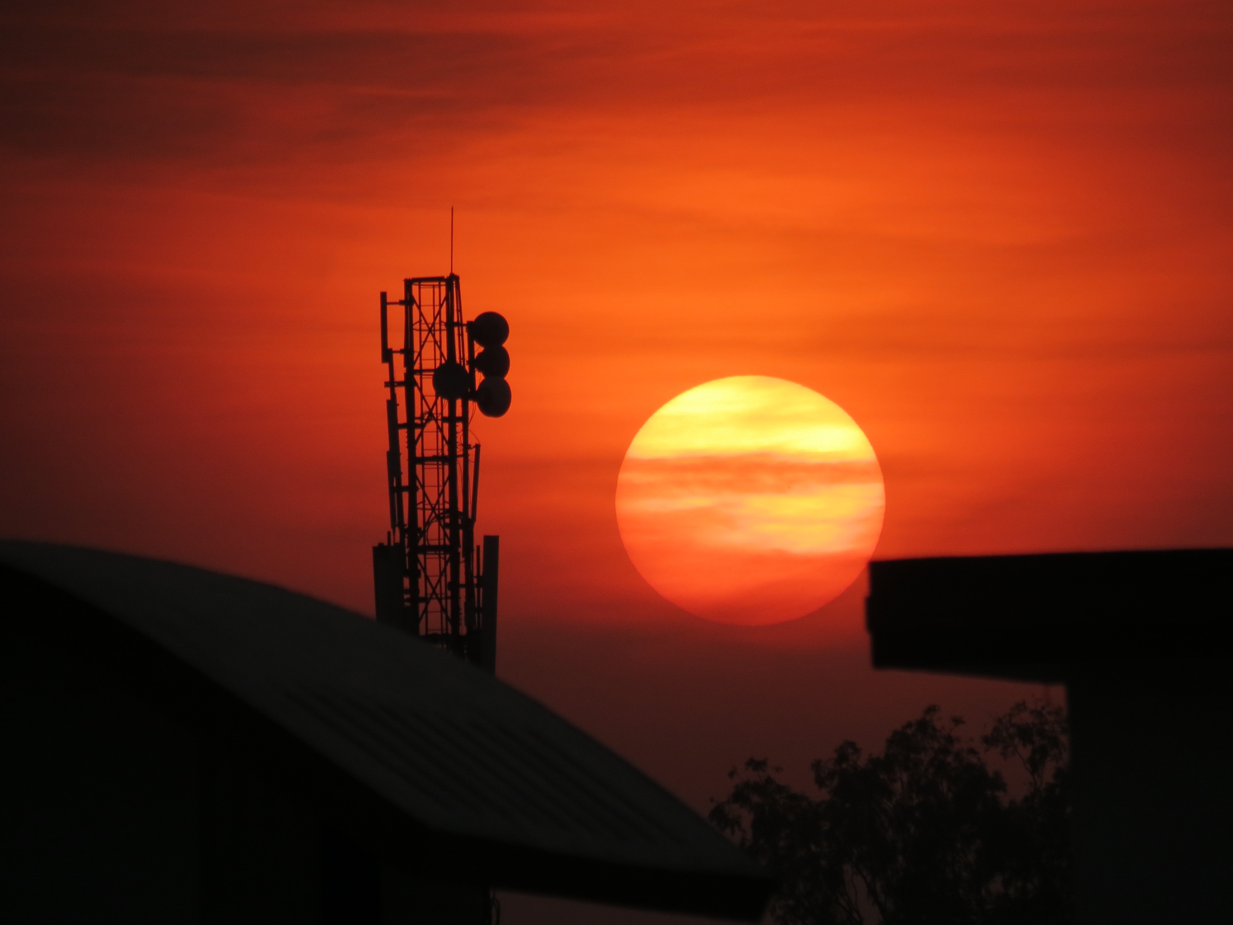 Communication tower during sunset photo