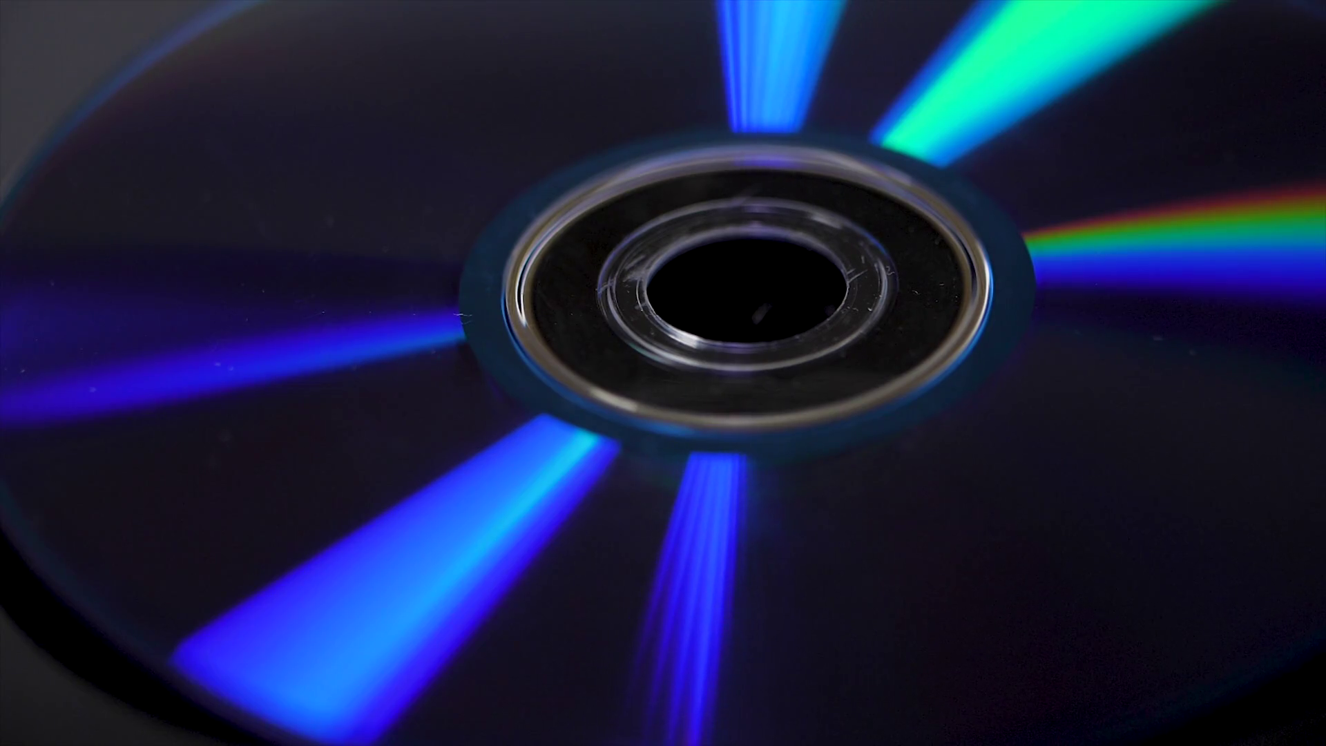 Compact disk isolated on black background. Abstract macro close up ...