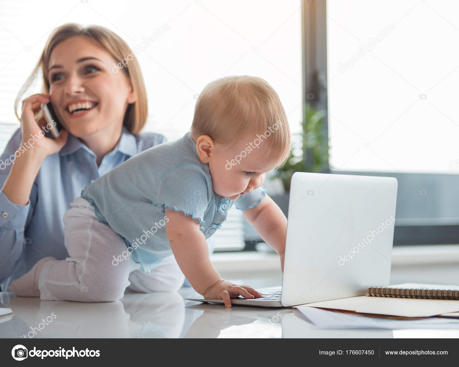 Interested kid playing with computer near mom — Stock Photo ...